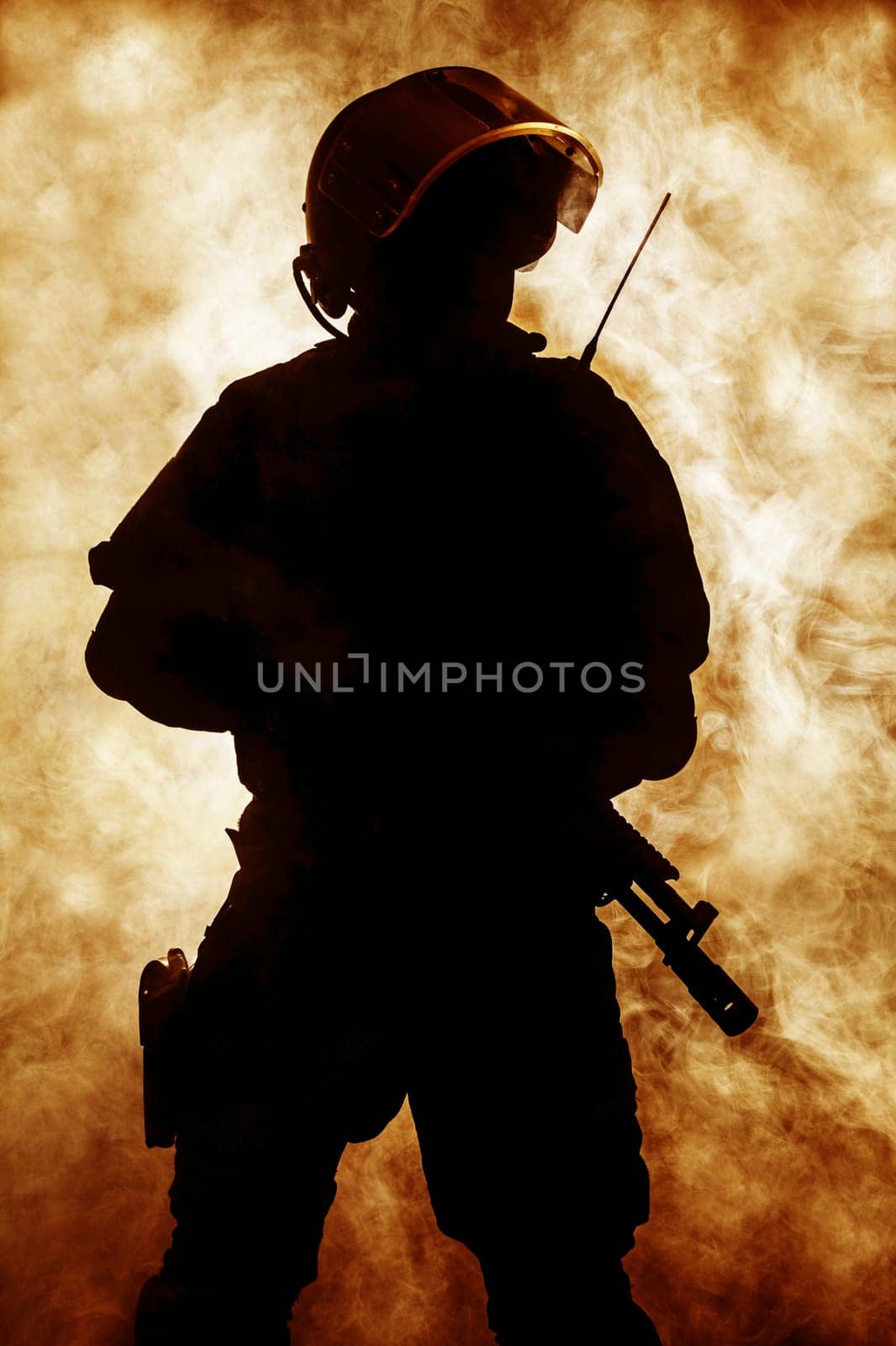 Russian special forces operator in bulletproof helmet in the smoke and fire
