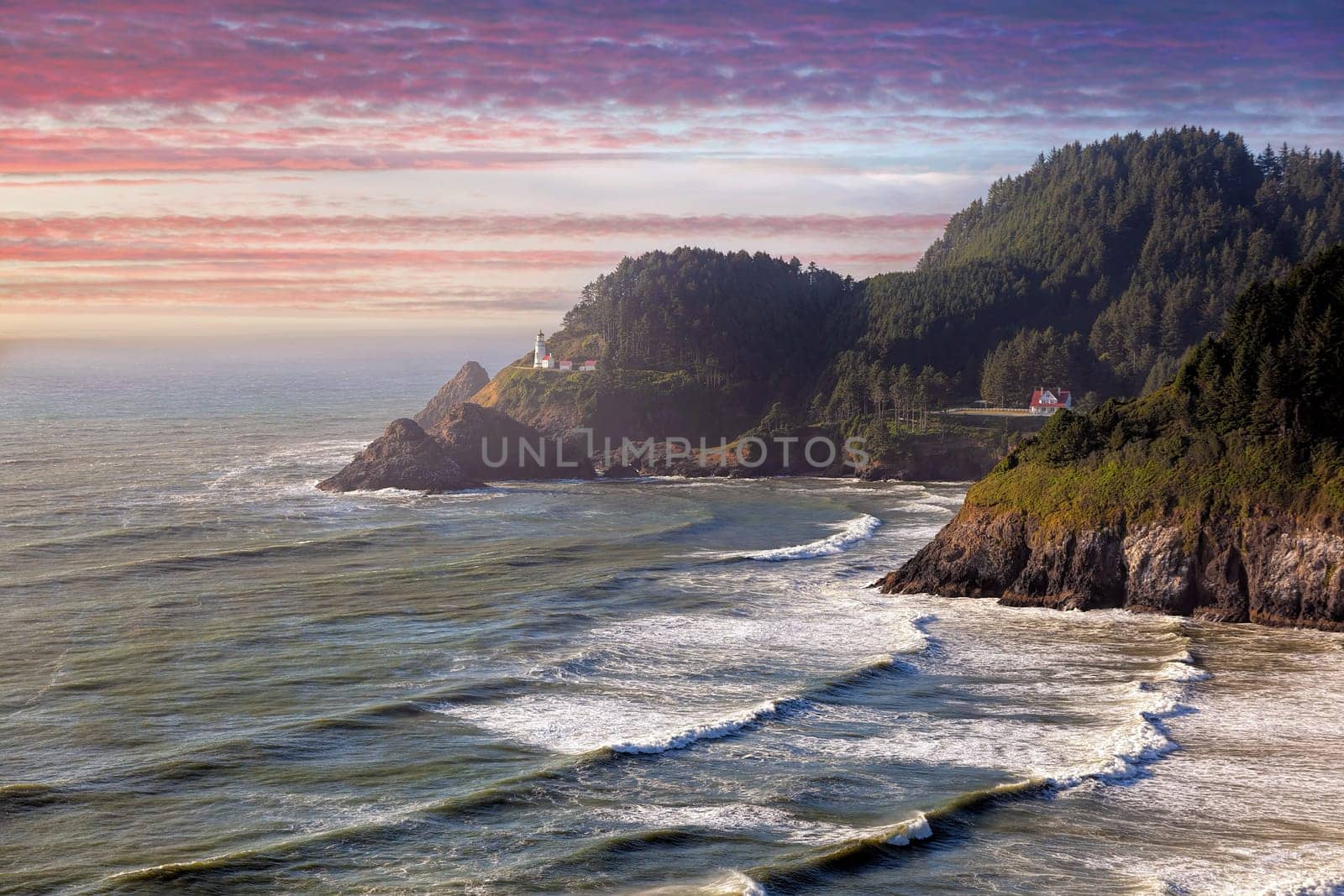 Heceta Head Lighthouse on the cliff of Devil’s Elbow State Park State Scenic Viewpoint at Sunset