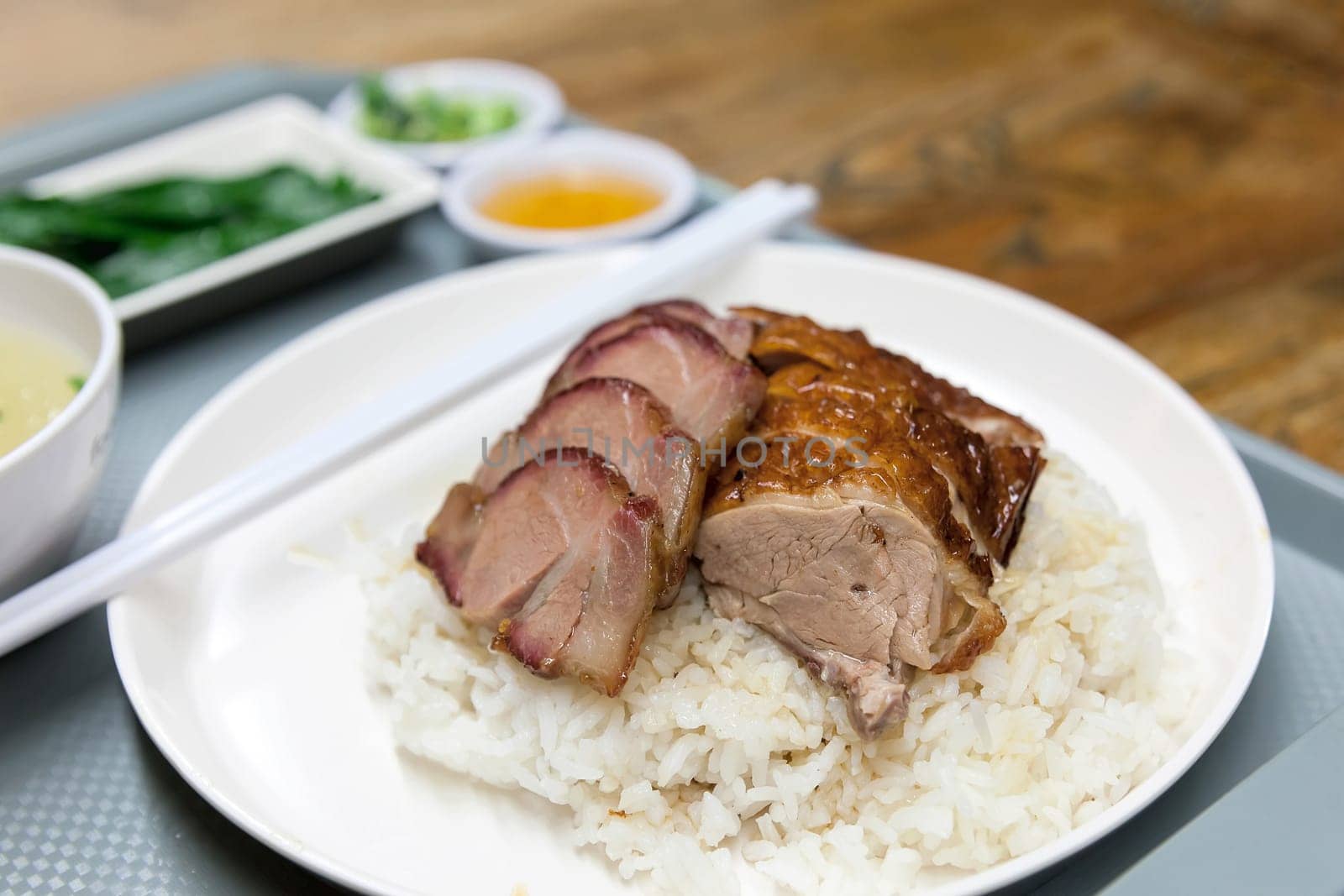Roast Duck and Barbecue Pork Over Rice Dish in Hong Kong Restaurant Macro