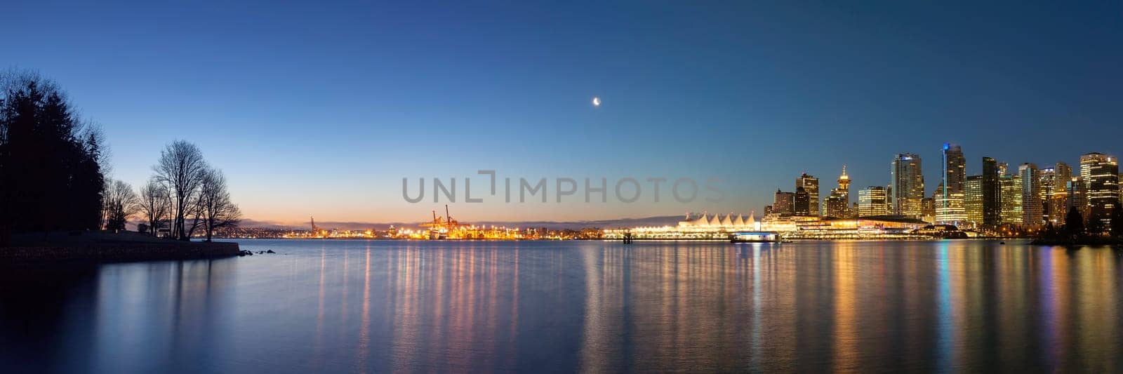 Vancouver British Columbia Canada City Lights and Skyline from Stanley Park at Dawn Blue Hour Panorama