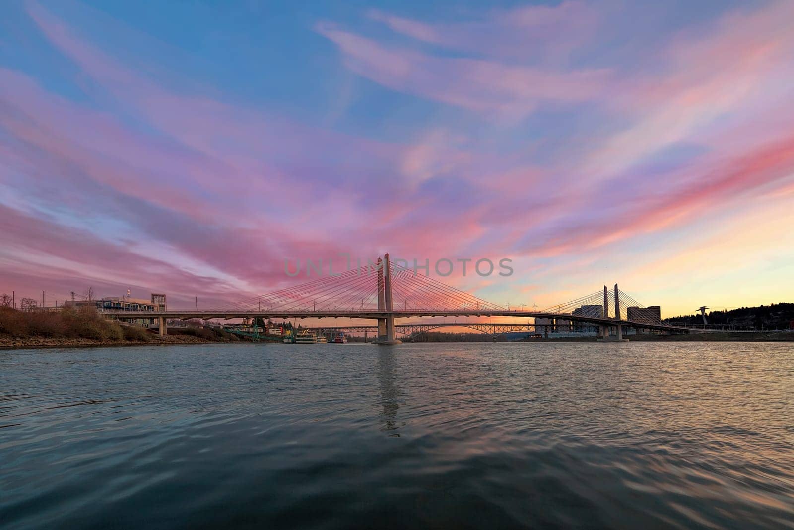 Tilikum Crossing and Ross Island Bridge Over Willamette River in Portland Oregon during Sunset