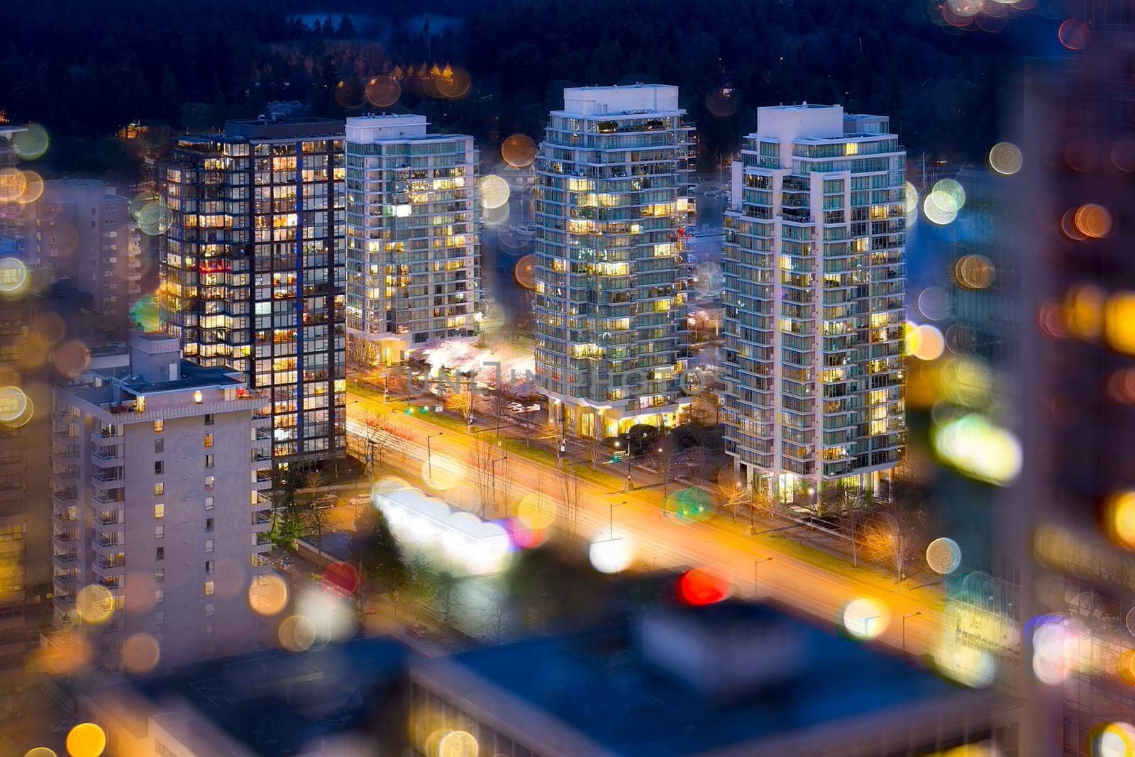 Vancouver British Columbia Cityscape with Blurred Defocused City Lights During Evening Blue Hour