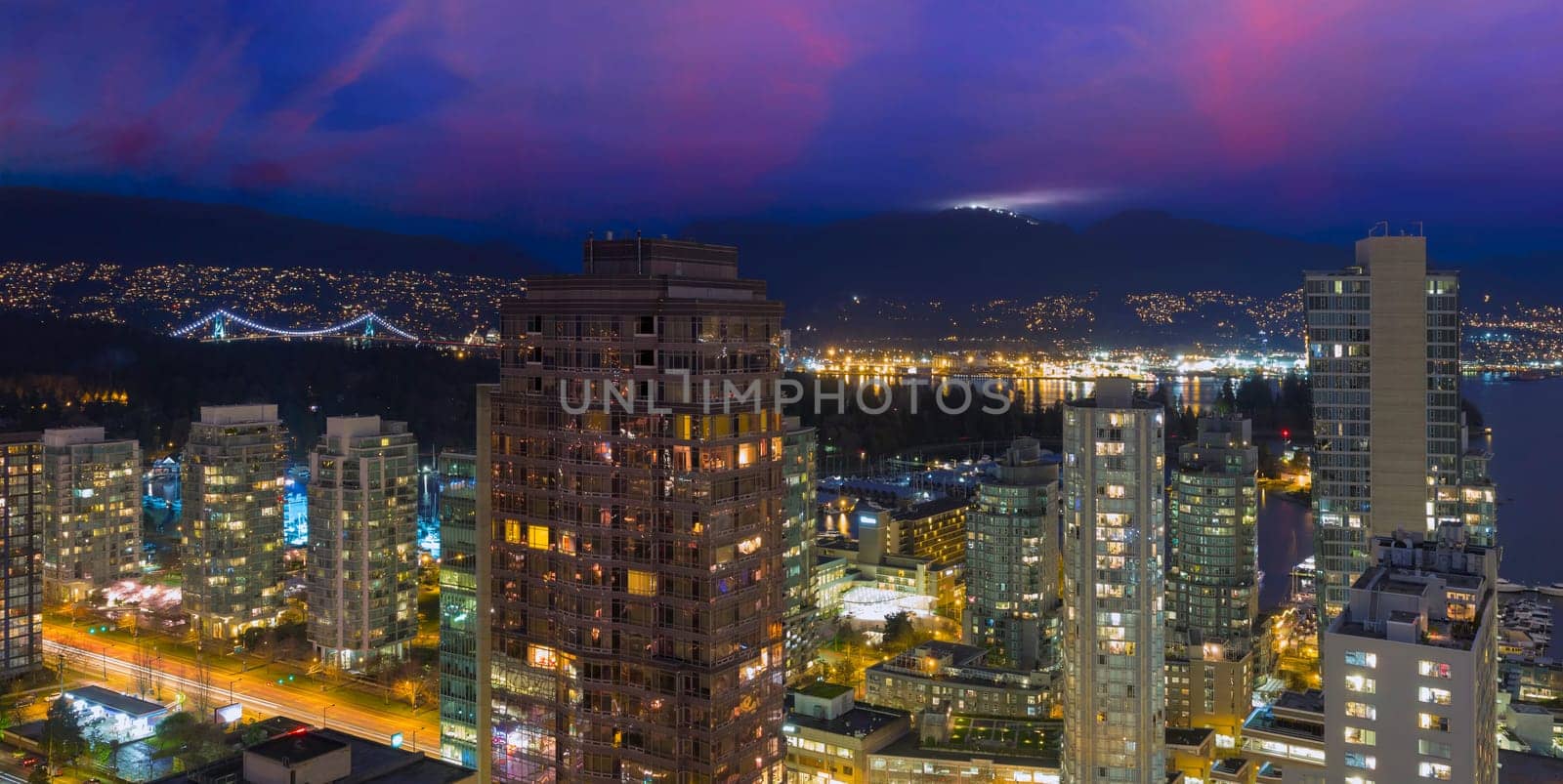 Vancouver British Columbia Canada Cityscape with Street Light Trails Stanley Park Grouse Mountain View at Dusk
