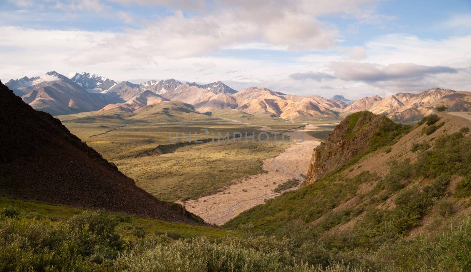 Puffy clouds and blue sky of the Alaska Range in Denali National Park