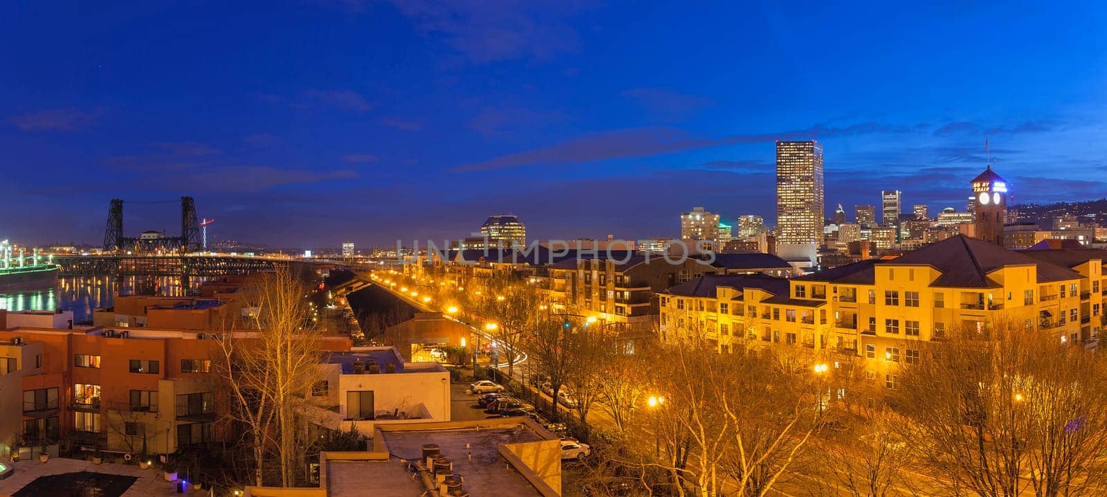 Portland Oregon Downtown Waterfront Cityscape with Steel Bridge during Evening Blue Hour Panorama