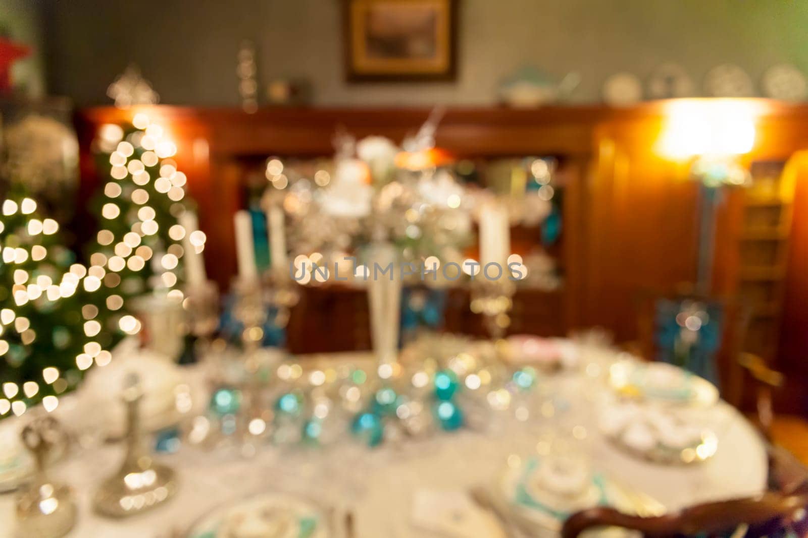 Christmas Day Holiday Celebration Dinner Table Decorations Blurred Defocused Bokeh Background