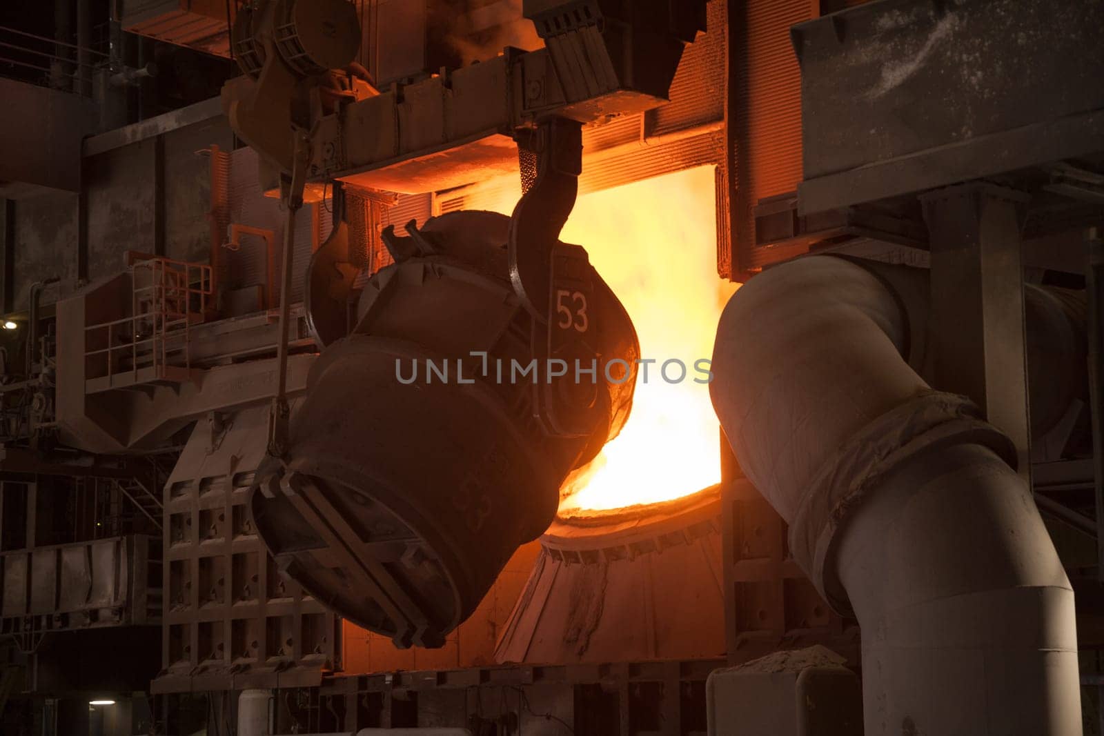 In the steelworks,the Bessemer converter is reloaded for steel production