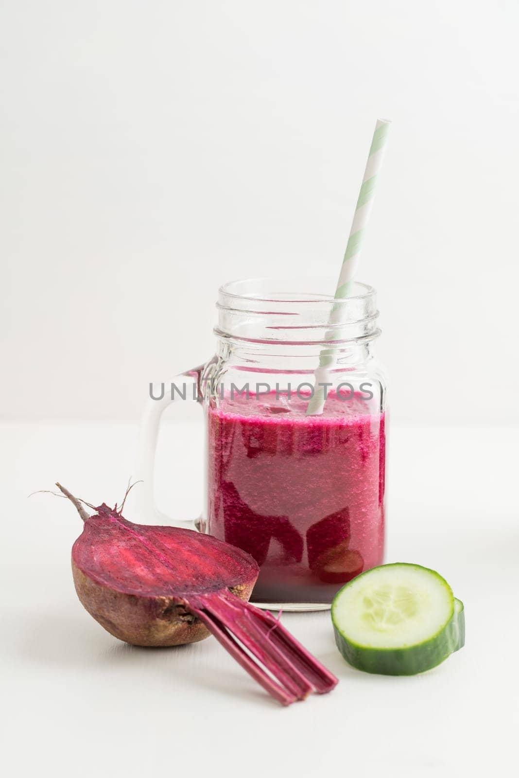 Red smoothie with beetroot and cucumber in a glass