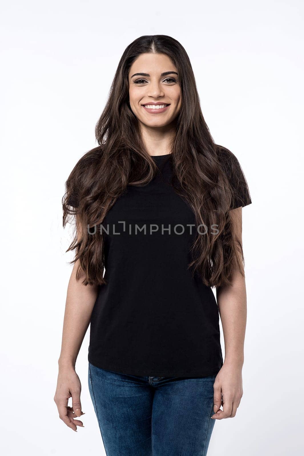 Casual pose of pretty young woman over white