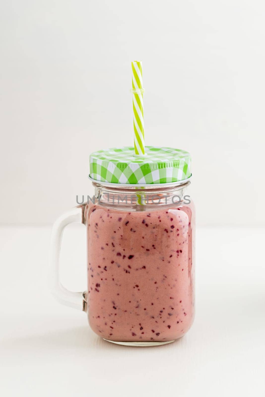 Pink healthy smoothie with yoghurt and plums