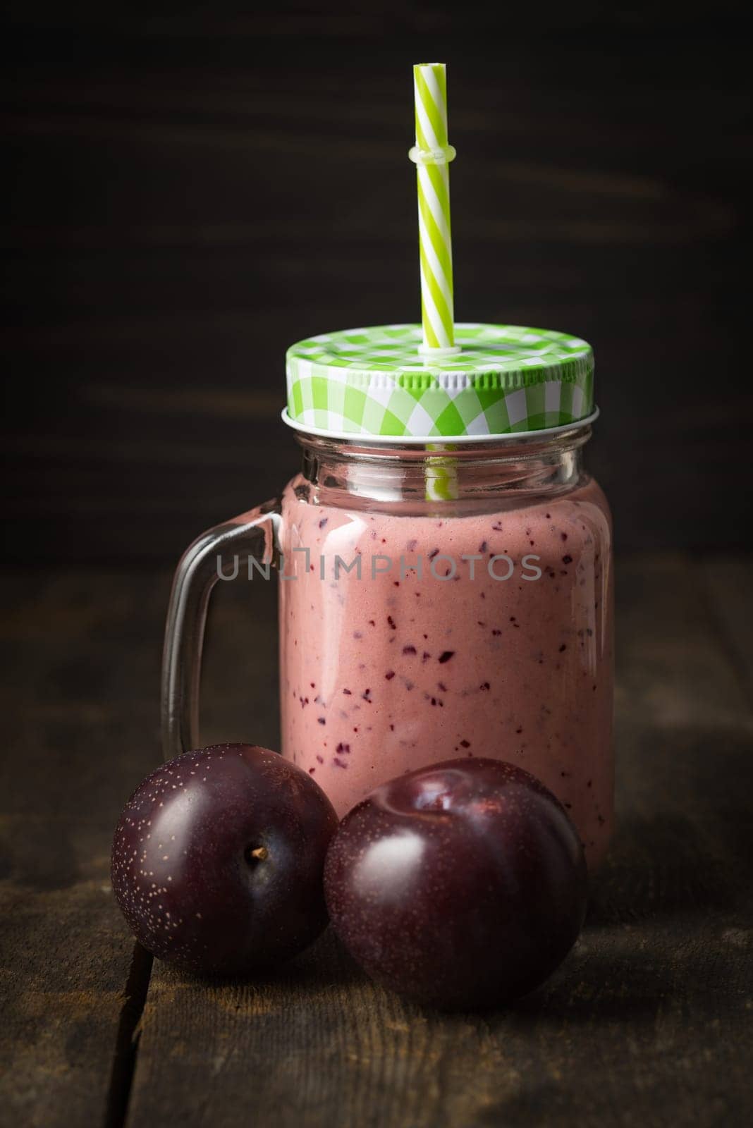 Pink healthy smoothie with yoghurt and plums