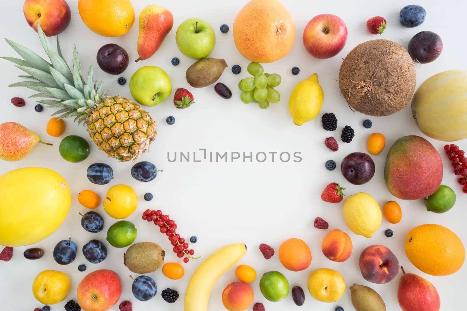 Collection of different types of fruit on a table with text space