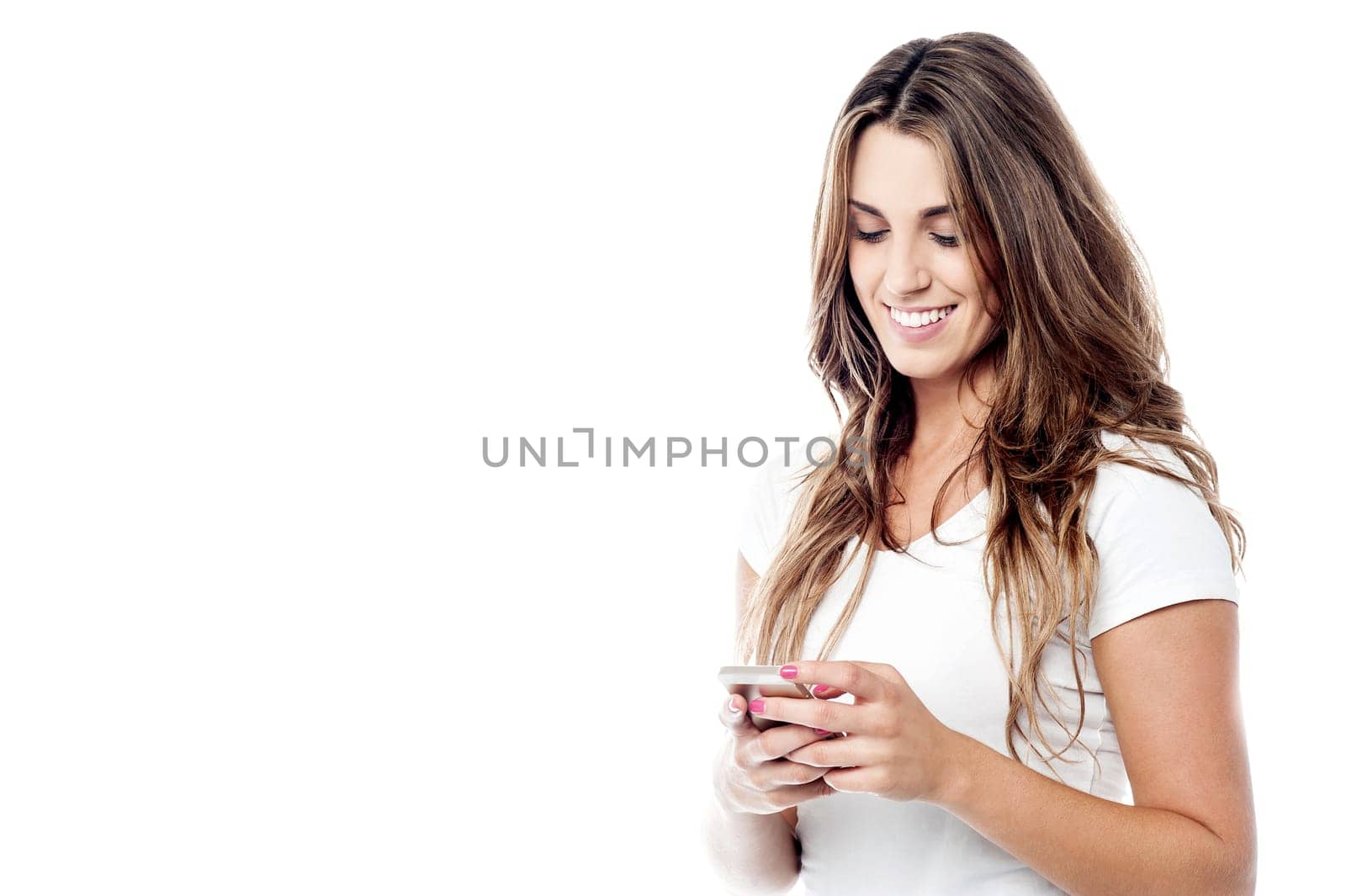 Cheerful woman messaging via her phone