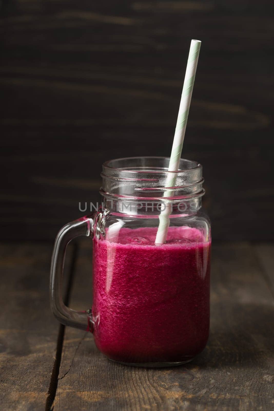 Red smoothie with beetroot and cucumber in a glass