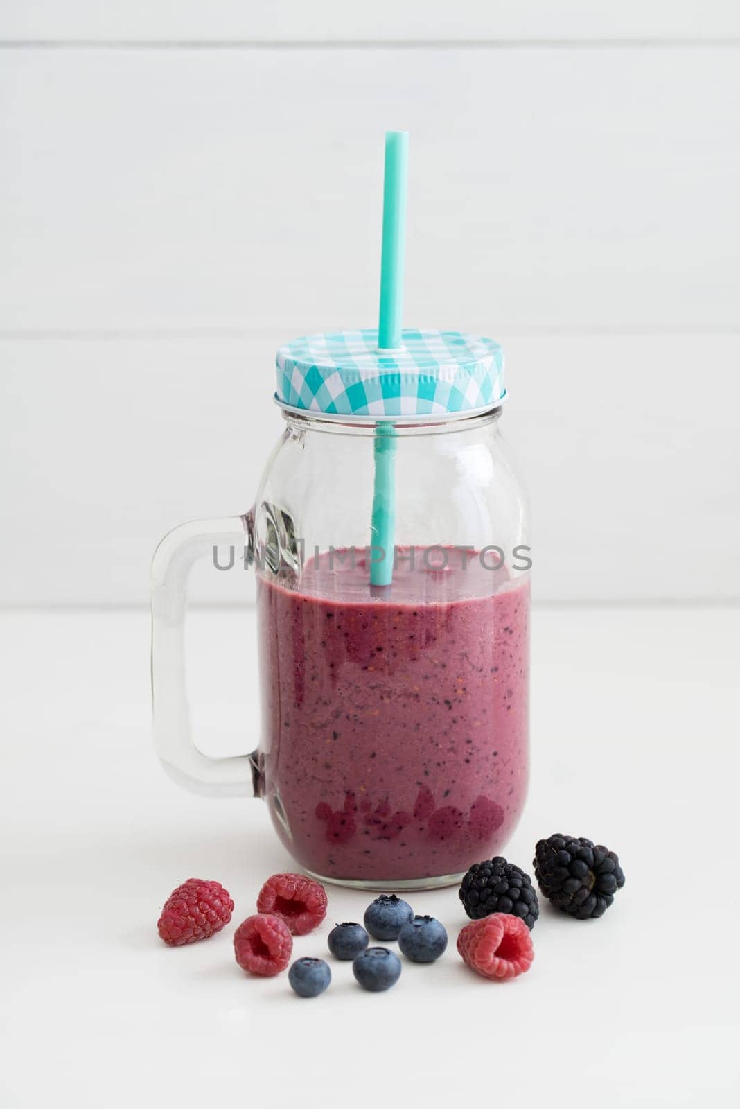 Pink healthy smoothie with yoghurt and berries