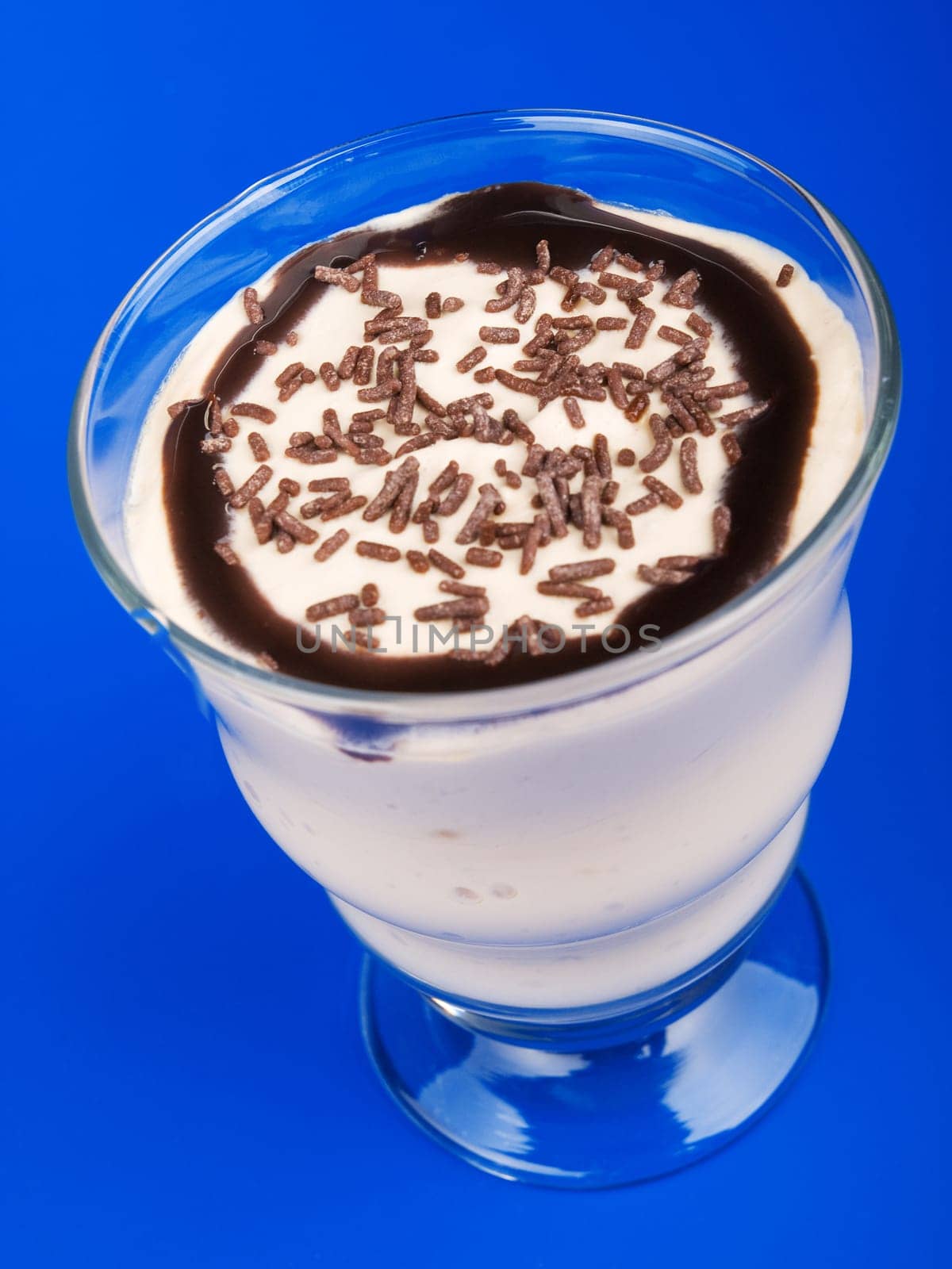 Vanilla pudding on blue background