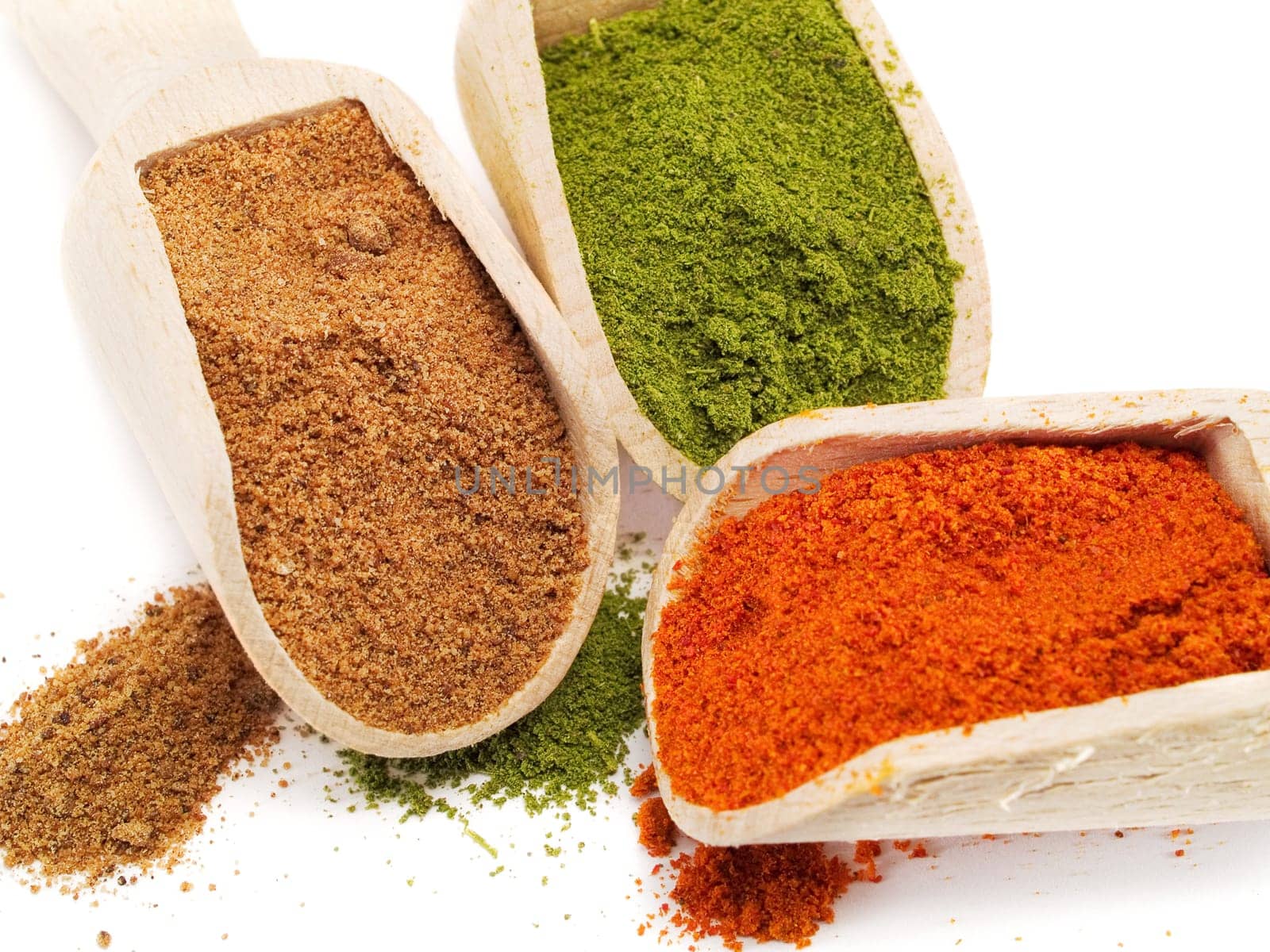 Red pepper, savory and black pepper on white