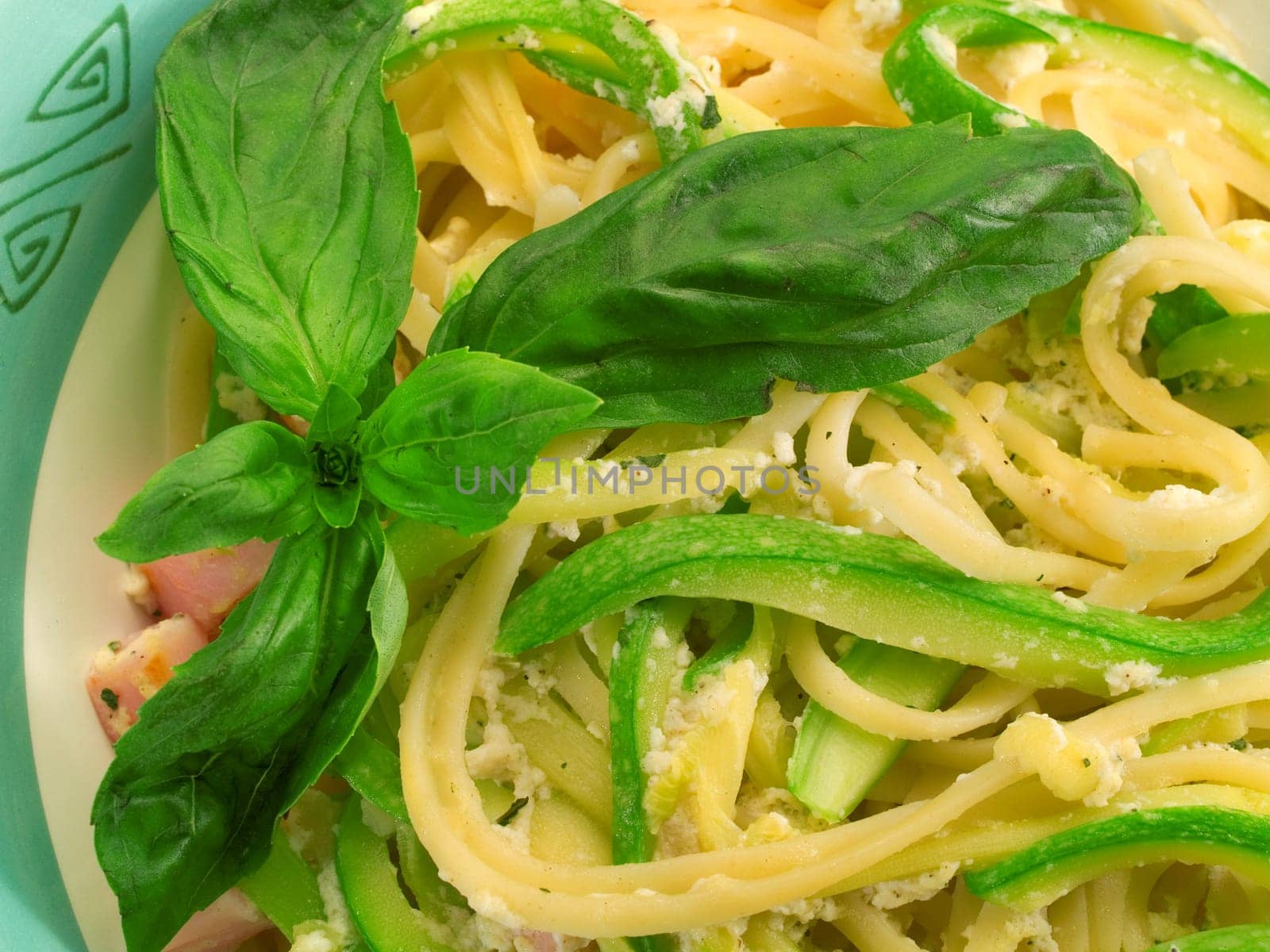 Linguini prepared with fried zucchini, eggs, basil and parmesan cheese