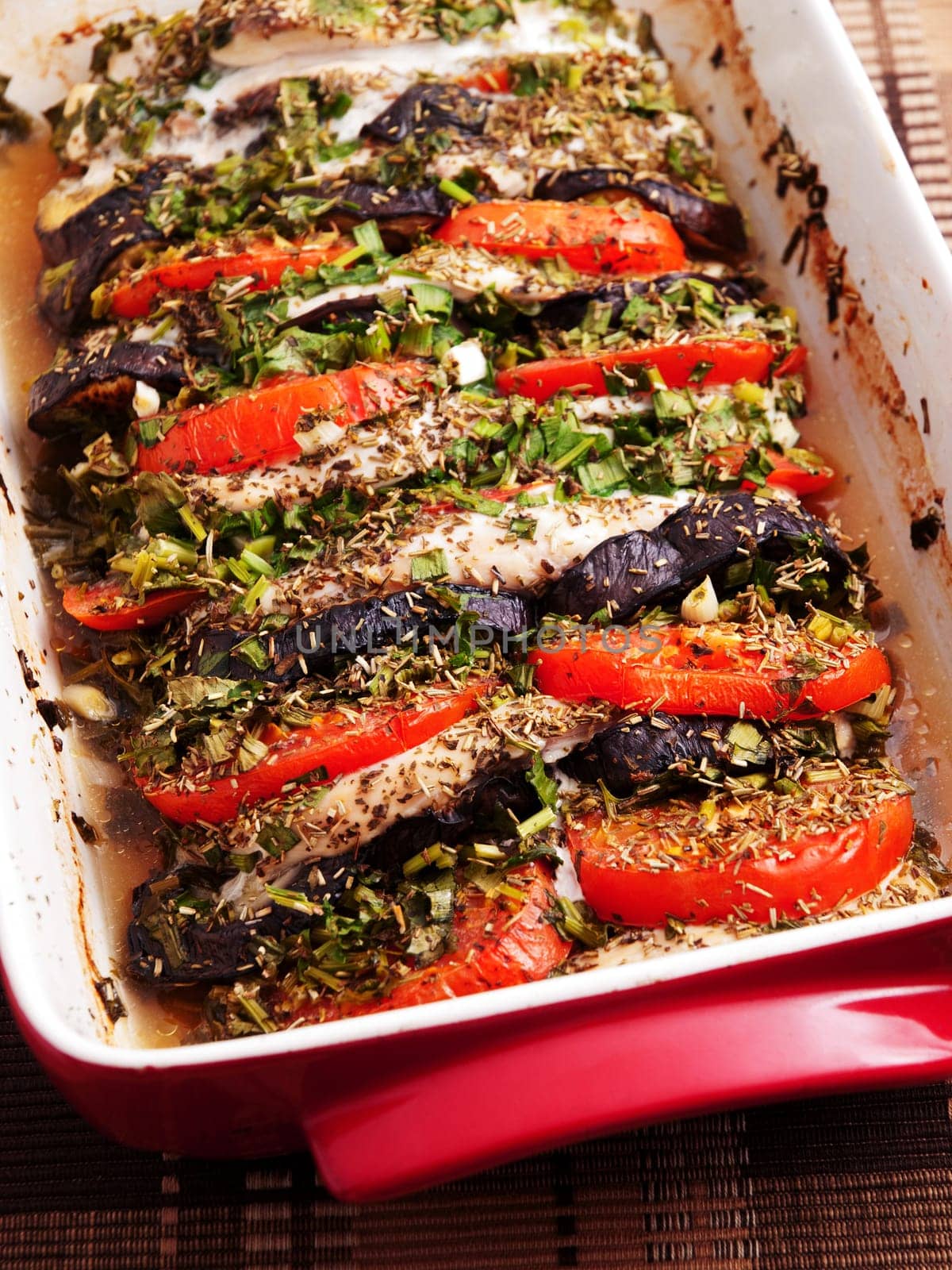 Baked eggplants with tomatos in a baking dish