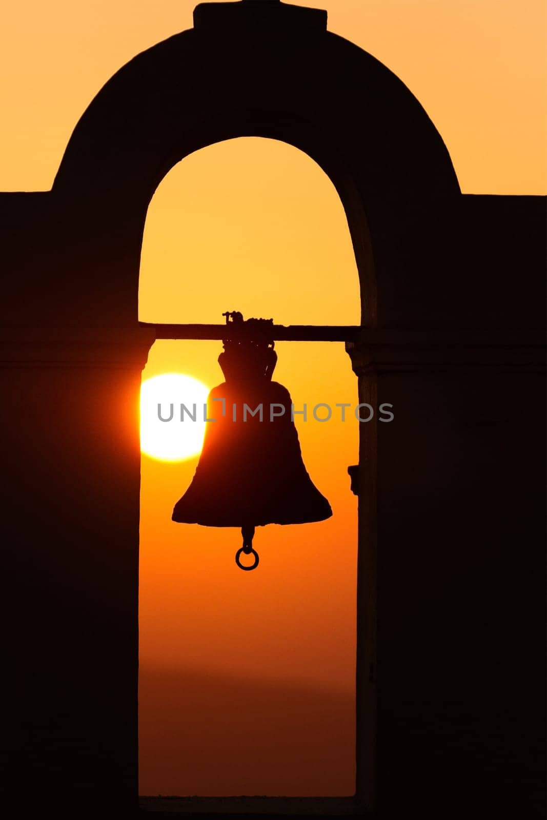 Famous church in Fira, Santorini at sunset