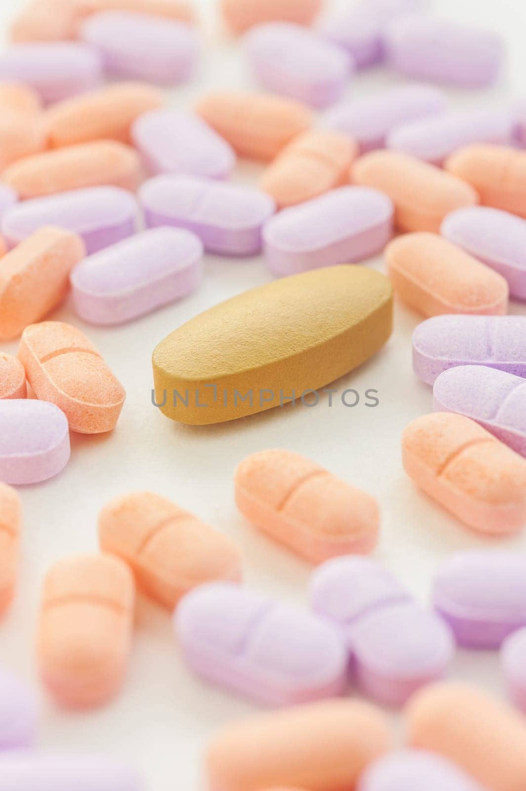 Pills spilling on a white background, Selective focus