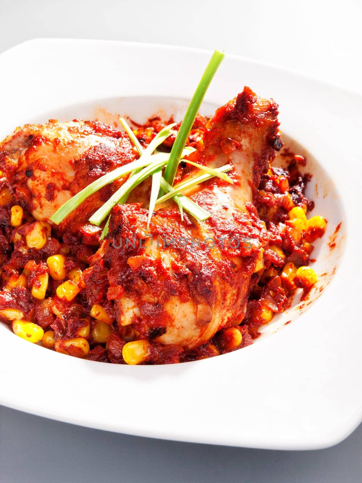 Mexican chicken with corn and tomatos