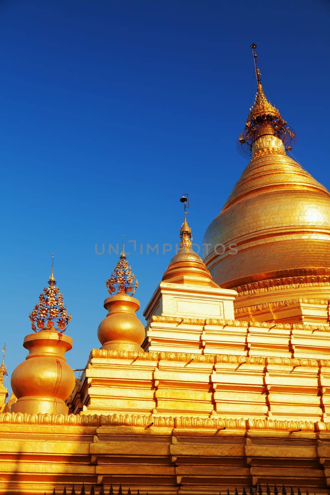 The Maha Lawka Marazein Pagoda at the center of the Kuthodaw Pagoda. Kuthodaw Pagoda is a Buddhist stupa, located in Mandalay, Burma (Myanmar), that contains the world's largest book. It lies at the foot of Mandalay Hill. In the grounds of the pagoda are 729 stone-inscription caves, each containing a marble slab inscribed on both sides with a page of text from the Tipitaka, the entire Pali Canon of Theravada Buddhism. Pagoda Kuthodaw stretching from 1860 to 1868 during the reign of King Mindona.