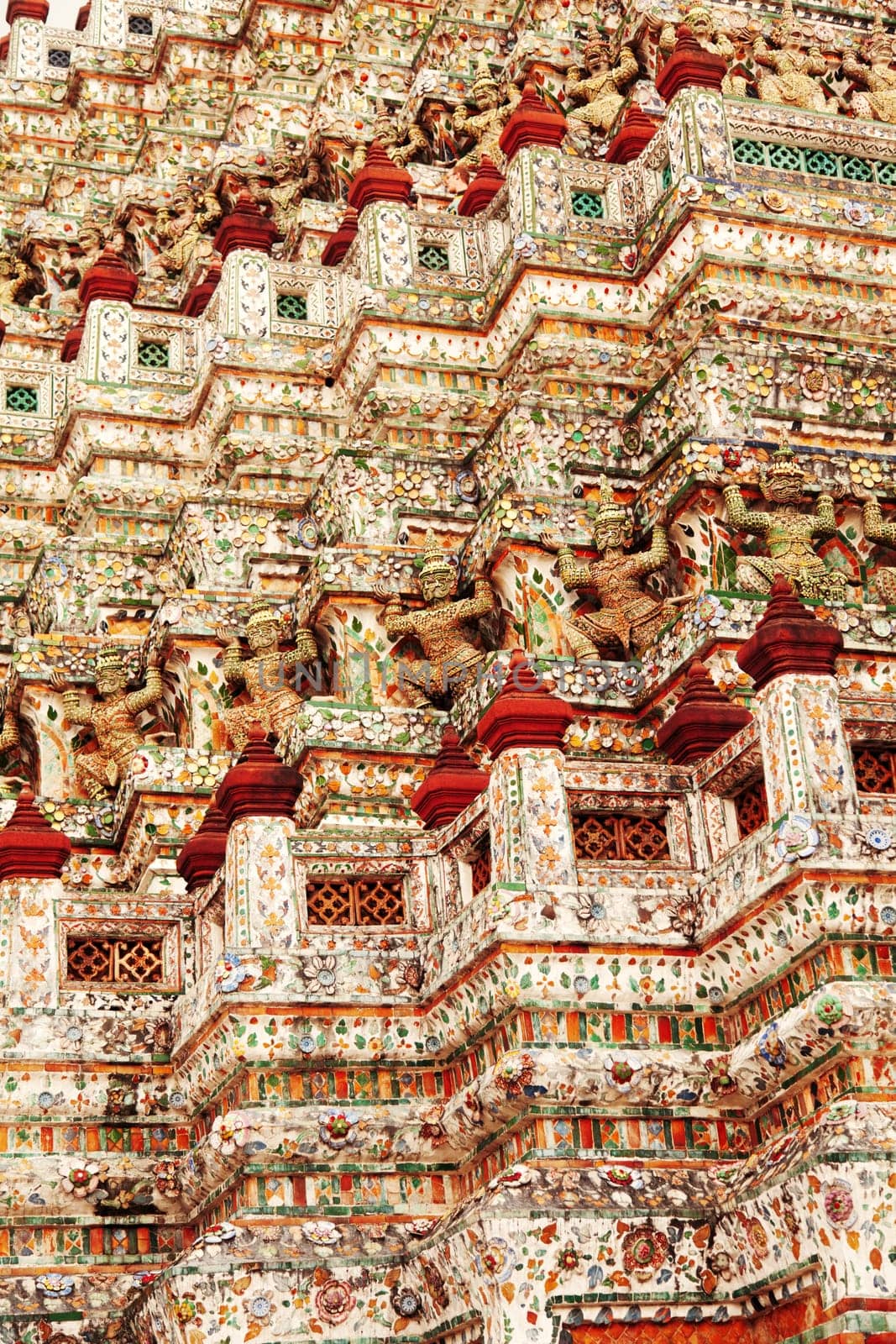 Wat Arun Rajwararam or Temple of the Dawn is a Buddhist temple (wat) in the Bangkok Yai district of Bangkok, Thailand, on the Thonburi west bank of the Chao Phraya River. The full name of the temple is Wat Arunratchawararam Ratchaworamahawihan. Named after Aruna, the Indian God of Dawn, the Wat Arun is considered one of the most well known landmark of Thailand. The prangs are decorated by seashells and bits of porcelain which had previously been used as ballast by boats coming to Bangkok from China.