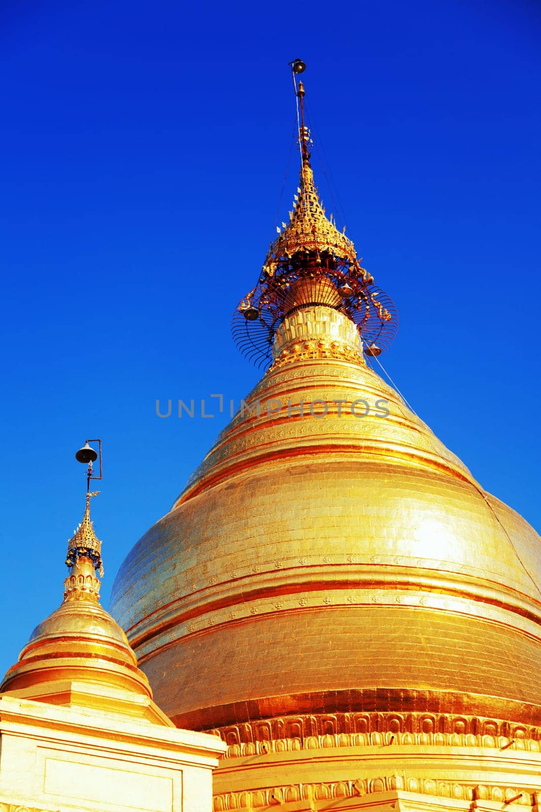 The Maha Lawka Marazein Pagoda at the center of the Kuthodaw Pagoda. Kuthodaw Pagoda is a Buddhist stupa, located in Mandalay, Burma (Myanmar), that contains the world's largest book. It lies at the foot of Mandalay Hill. In the grounds of the pagoda are 729 stone-inscription caves, each containing a marble slab inscribed on both sides with a page of text from the Tipitaka, the entire Pali Canon of Theravada Buddhism. Pagoda Kuthodaw stretching from 1860 to 1868 during the reign of King Mindona.