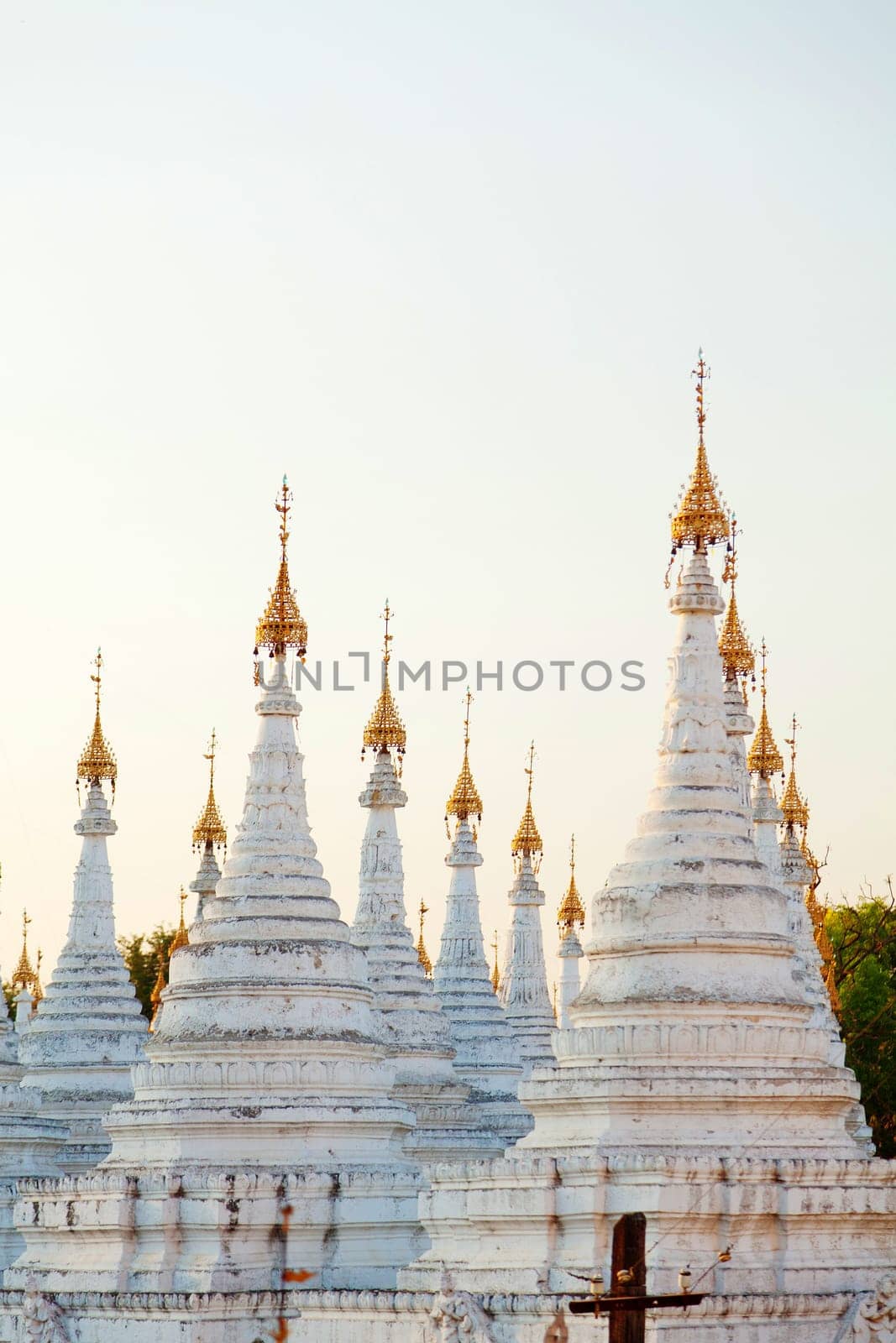 Kuthodaw Pagoda is a Buddhist stupa, located in Mandalay, Burma (Myanmar), that contains the world's largest book. It lies at the foot of Mandalay Hill. In the grounds of the pagoda are 729 stone-inscription caves, each containing a marble slab inscribed on both sides with a page of text from the Tipitaka, the entire Pali Canon of Theravada Buddhism. Pagoda Kuthodaw stretching from 1860 to 1868 during the reign of King Mindona.