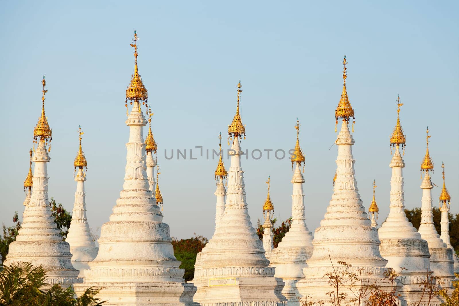 Kuthodaw Pagoda is a Buddhist stupa, located in Mandalay, Burma (Myanmar), that contains the world's largest book. It lies at the foot of Mandalay Hill. In the grounds of the pagoda are 729 stone-inscription caves, each containing a marble slab inscribed on both sides with a page of text from the Tipitaka, the entire Pali Canon of Theravada Buddhism. Pagoda Kuthodaw stretching from 1860 to 1868 during the reign of King Mindona.