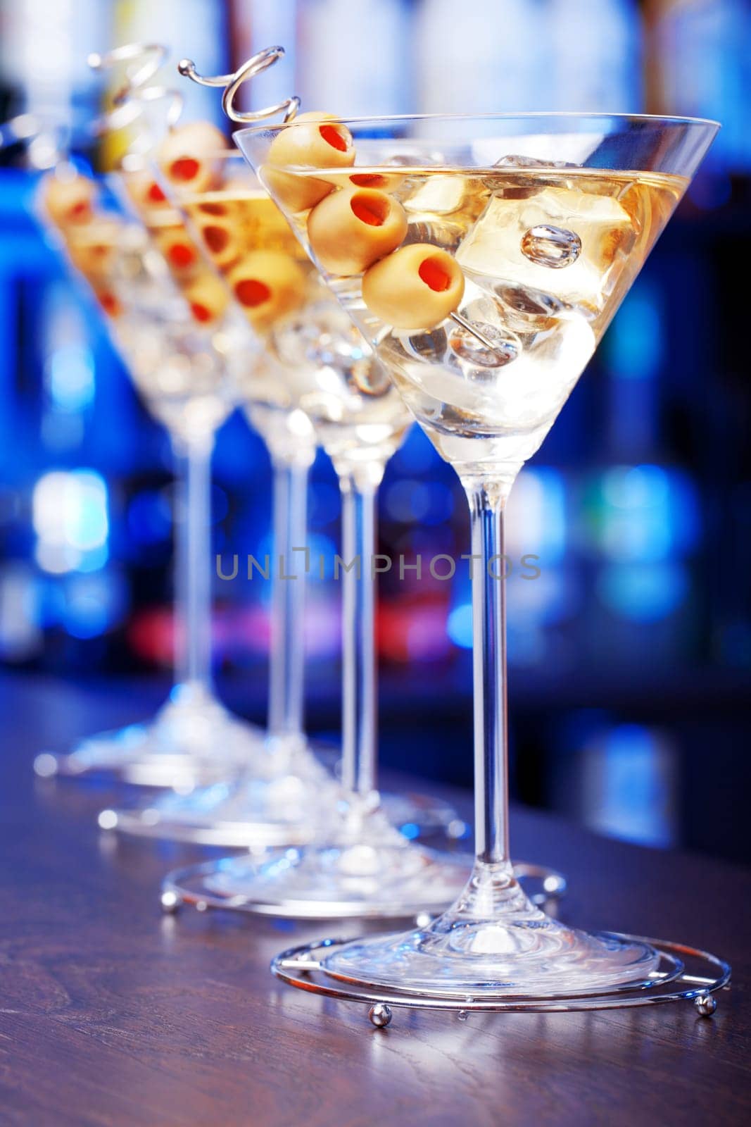 Several glasses of famous cocktail Martini, shot at a bar with shallow depth of field....Ingredients