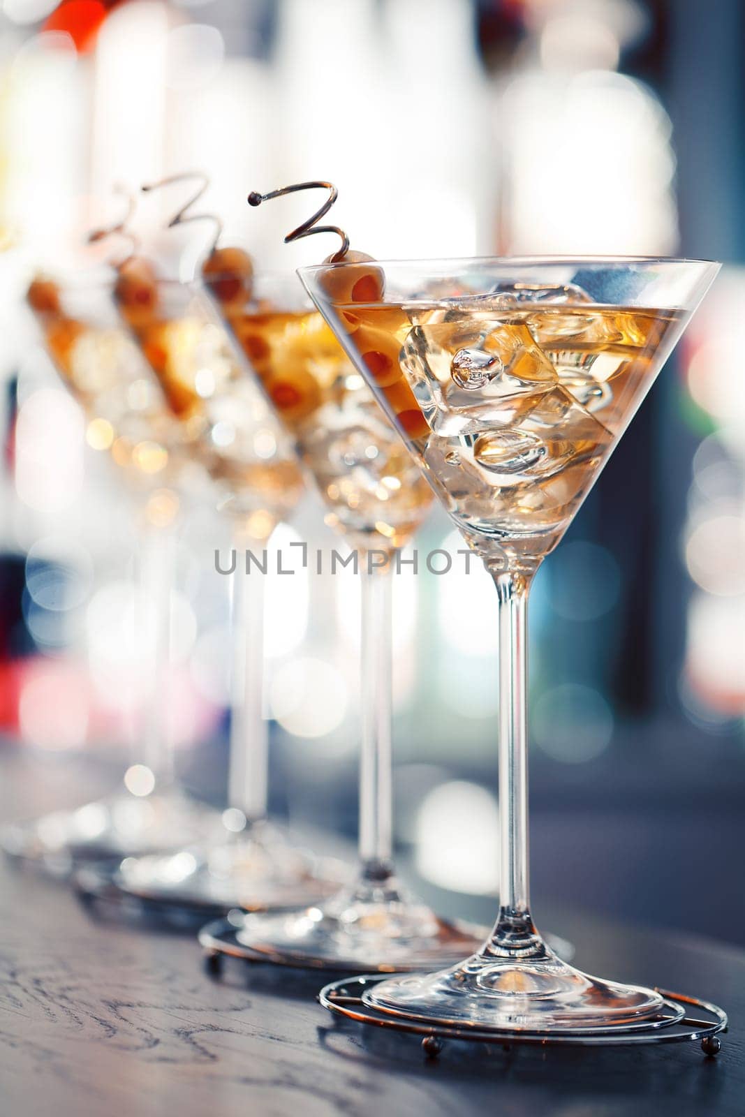 Several glasses of famous cocktail Martini, shot at a bar with shallow depth of field..Ingredients