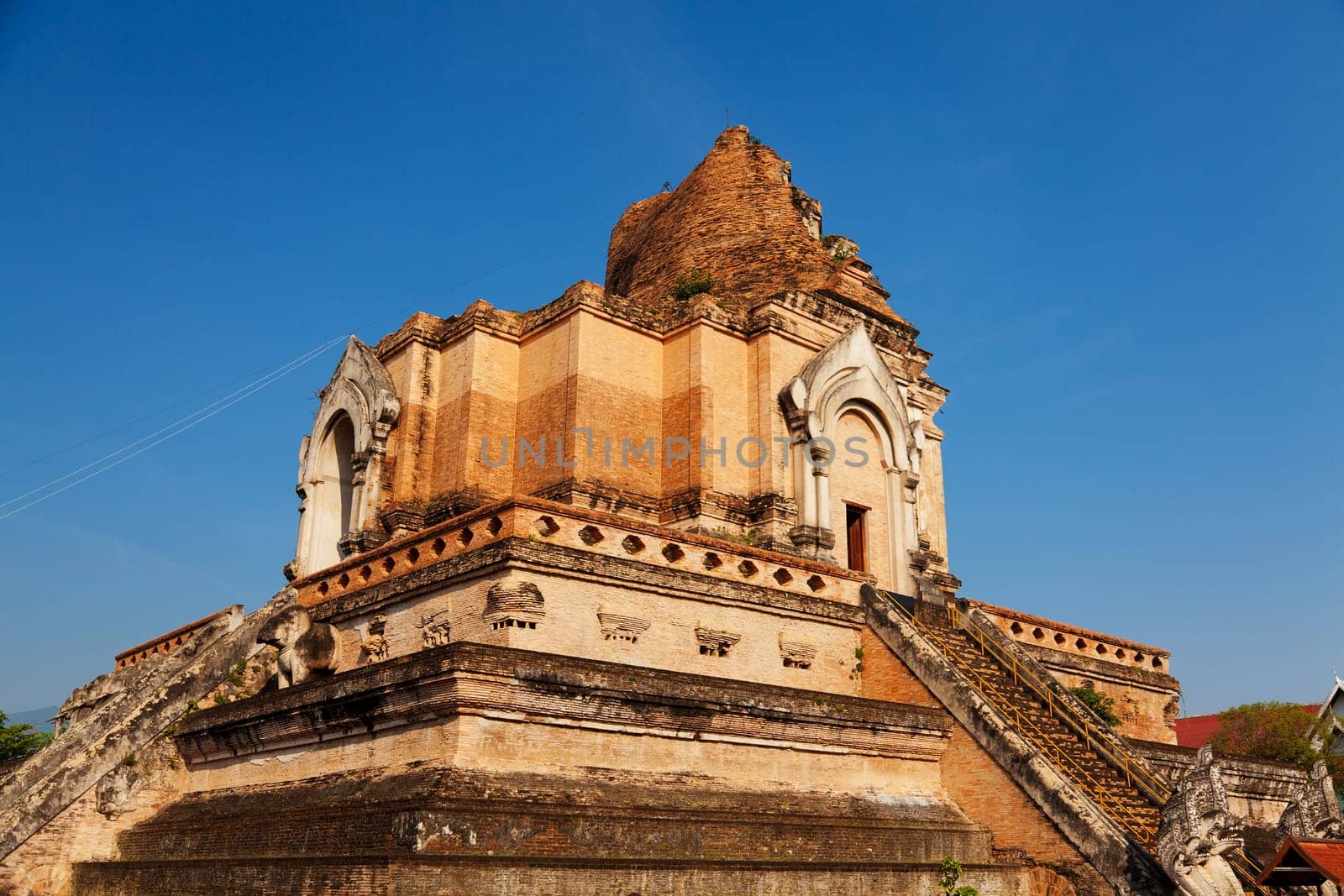 Wat Chedi Luang is a Buddhist temple in the historic centre of Chiang Mai, Thailand. The current temple grounds were originally made up of three temples — Wat Chedi Luang, Wat Ho Tham and Wat Sukmin.
