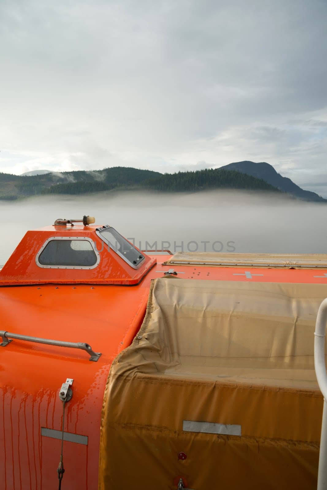 A pod designed to save 150 people is secured to a ferry boat
