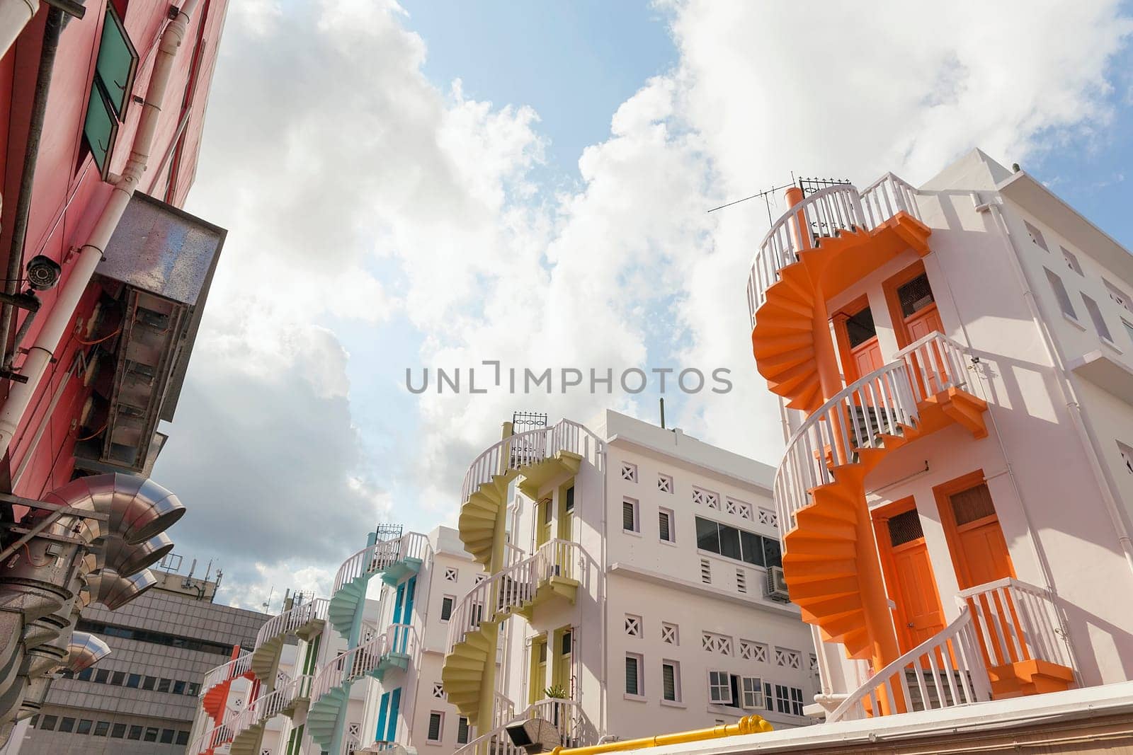 Colorful Row of Spiral Staircase in the Back Alley of Bugis Village Area in Singapore