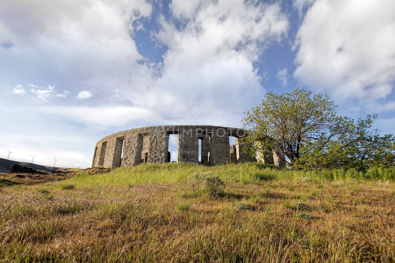 Stonehenge Replica Memorial at Maryhill Washington with White Clouds Blue Sky Scenic Landscape