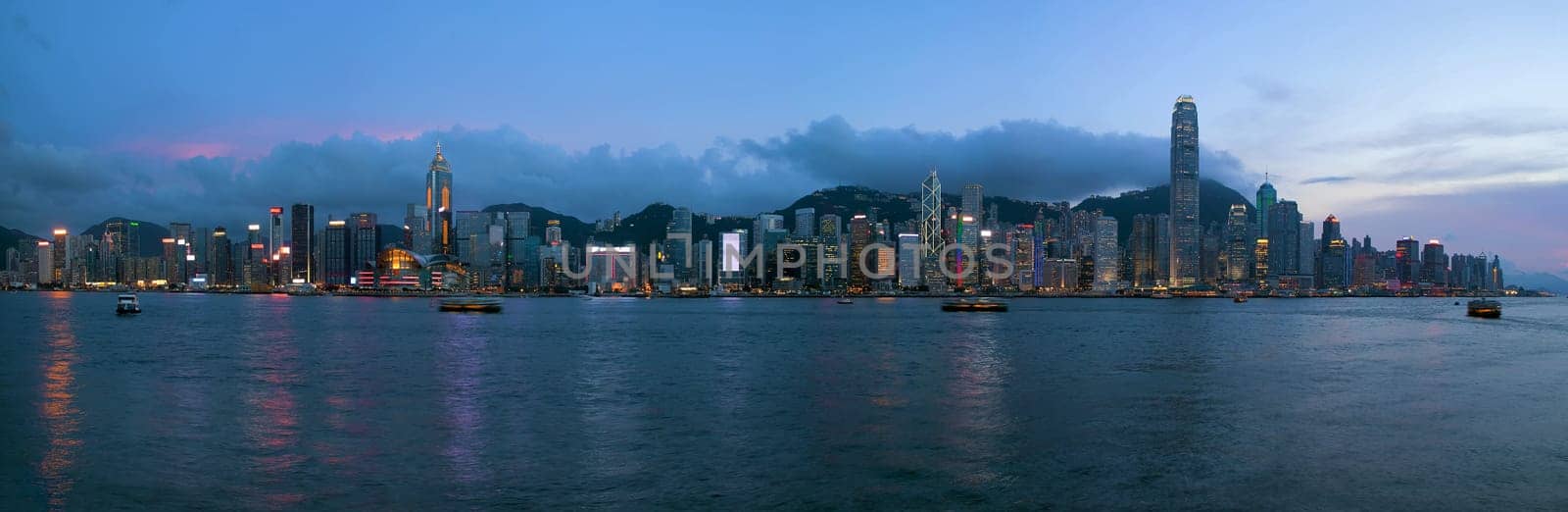 Hong Kong Island Central City Skyline Along Victoria Harbor Sunset Blue Hour Panorama
