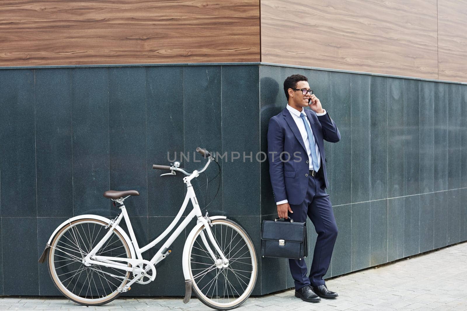Modern agent speaking on the phone outdoors