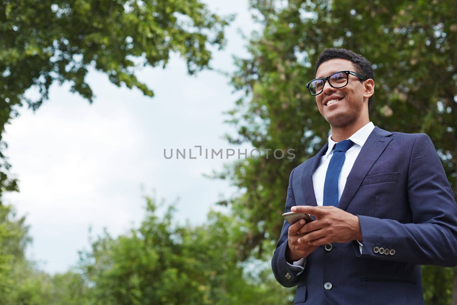 Modern young employee in natural environment