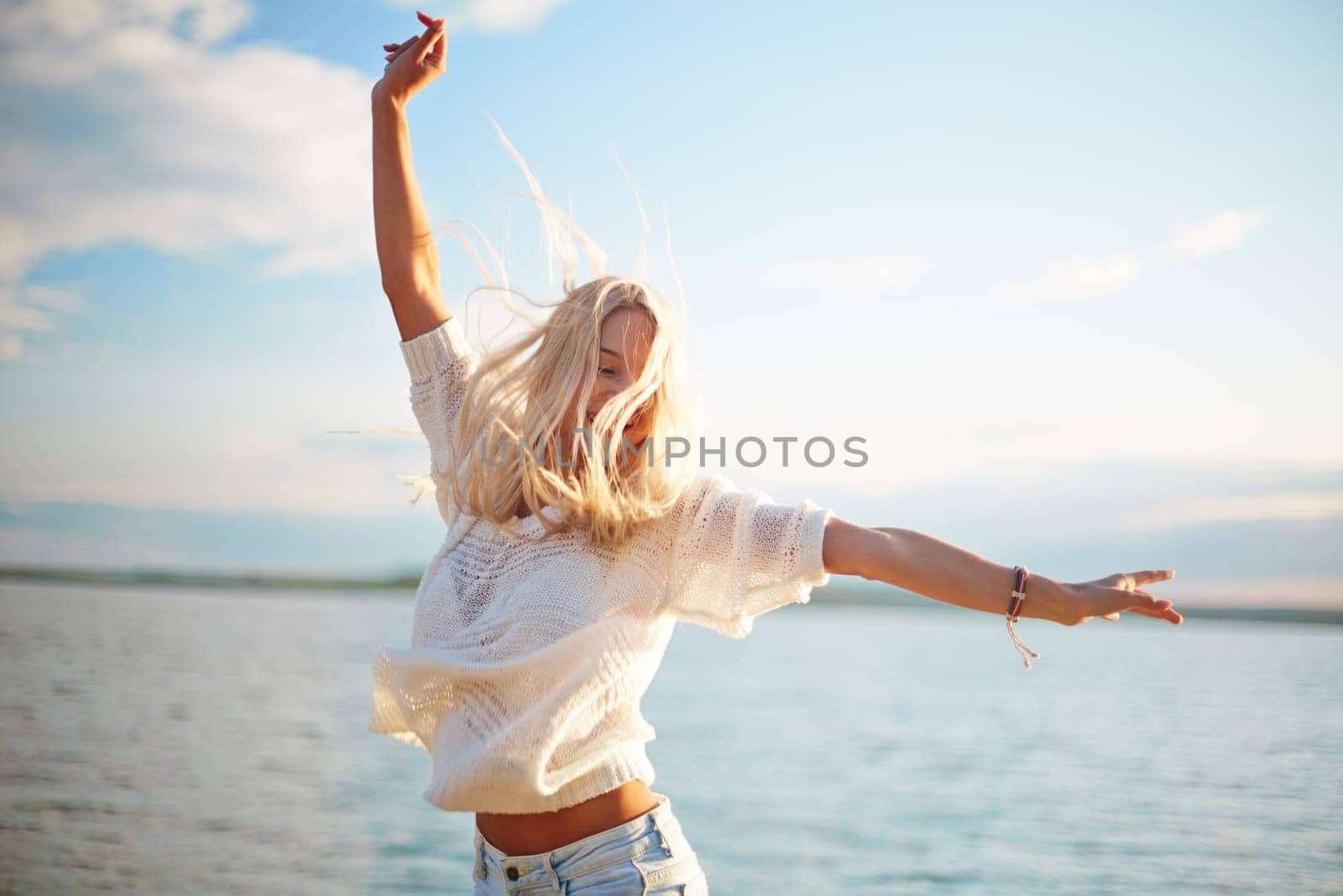 Delighted blond girl enjoying summer rest