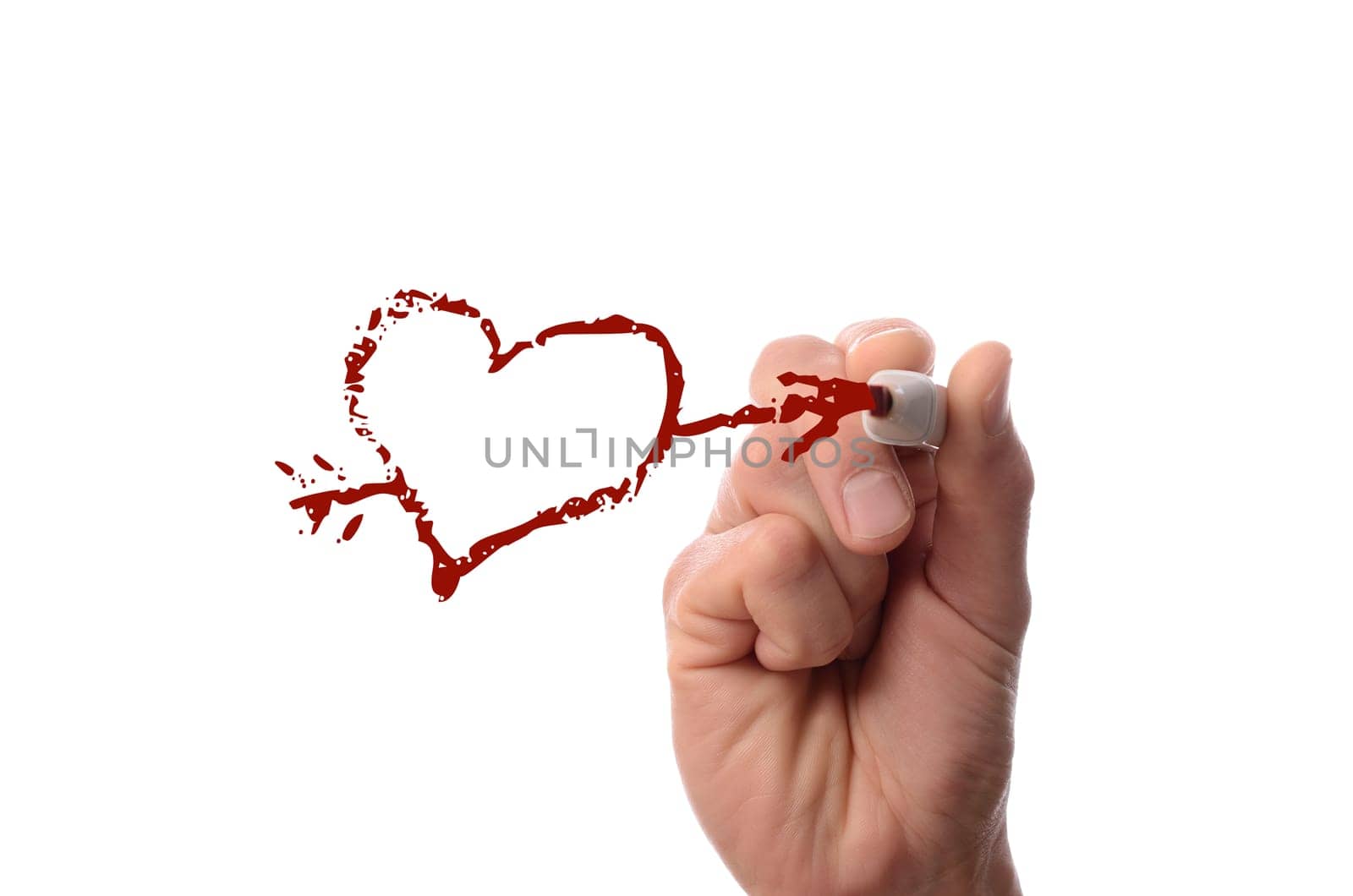 Hand drawing a heart shape on glass