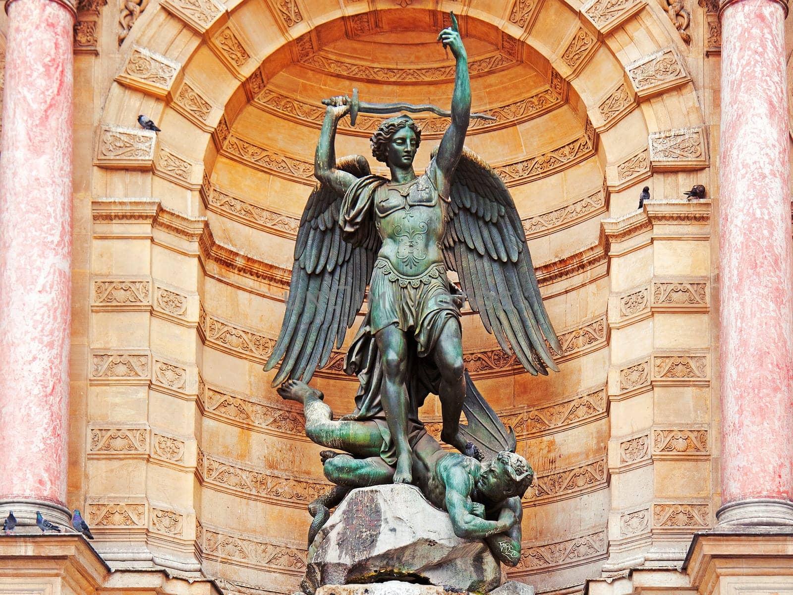 The statue of Saint Michael atop the fountain in the Place Saint-Michel at the northern end of the Boulevard Saint-Michel