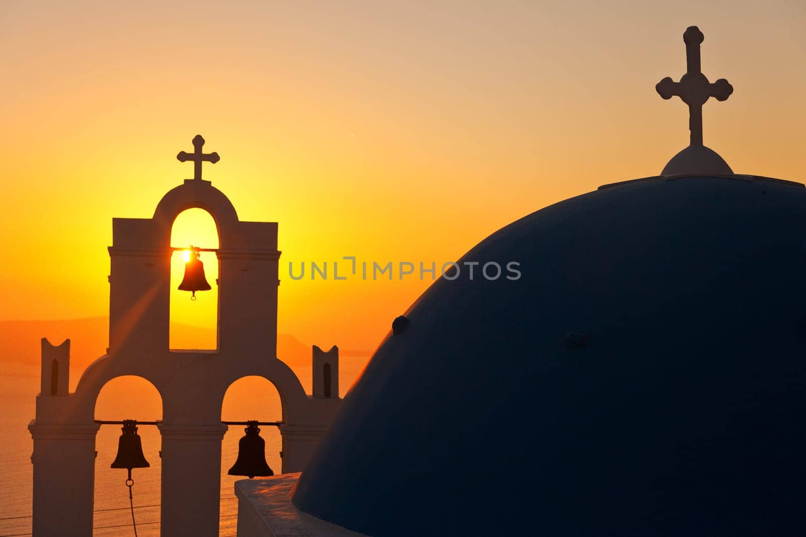 Famous church in Fira, Santorini at sunset