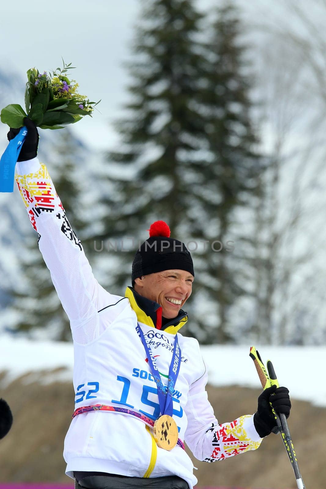 The winning smile is back: Andrea ESKAU holds the GOLDMEDAILLE after the cross-country race over five kilometers Cross Country Skianglauf - 9th day of competition Paralympics Sochi 2014 / Paralympic Winter Games Sochi 2014