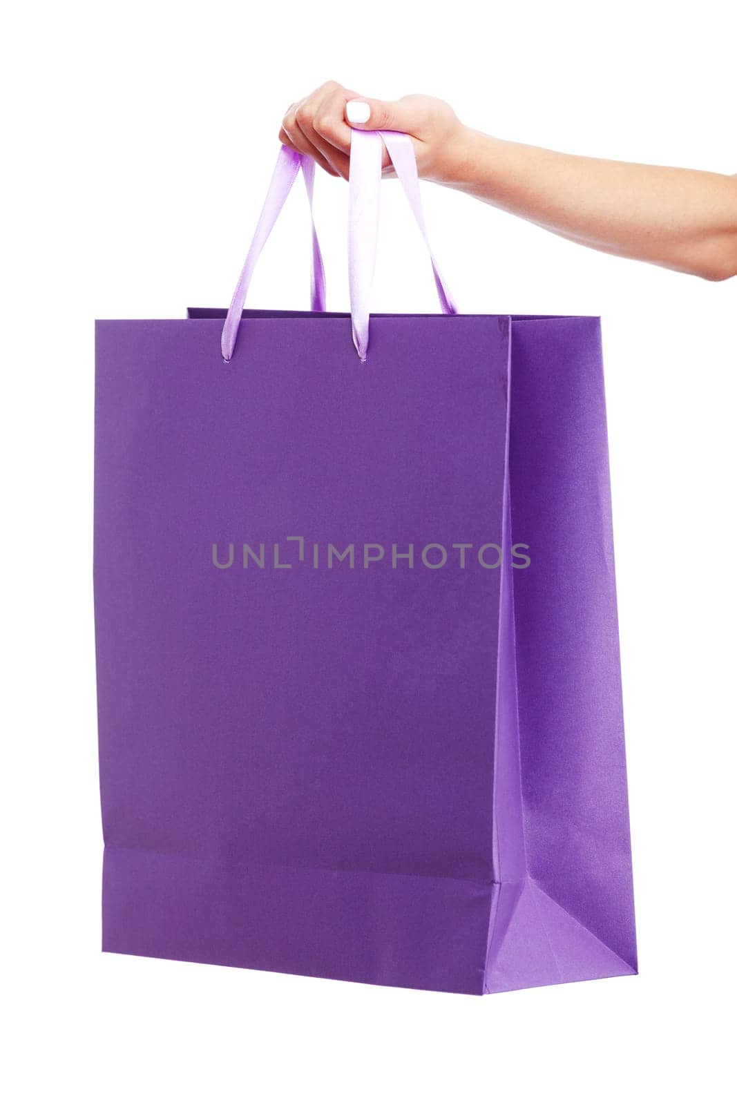 Young woman carrying shopping bag isolated on white background