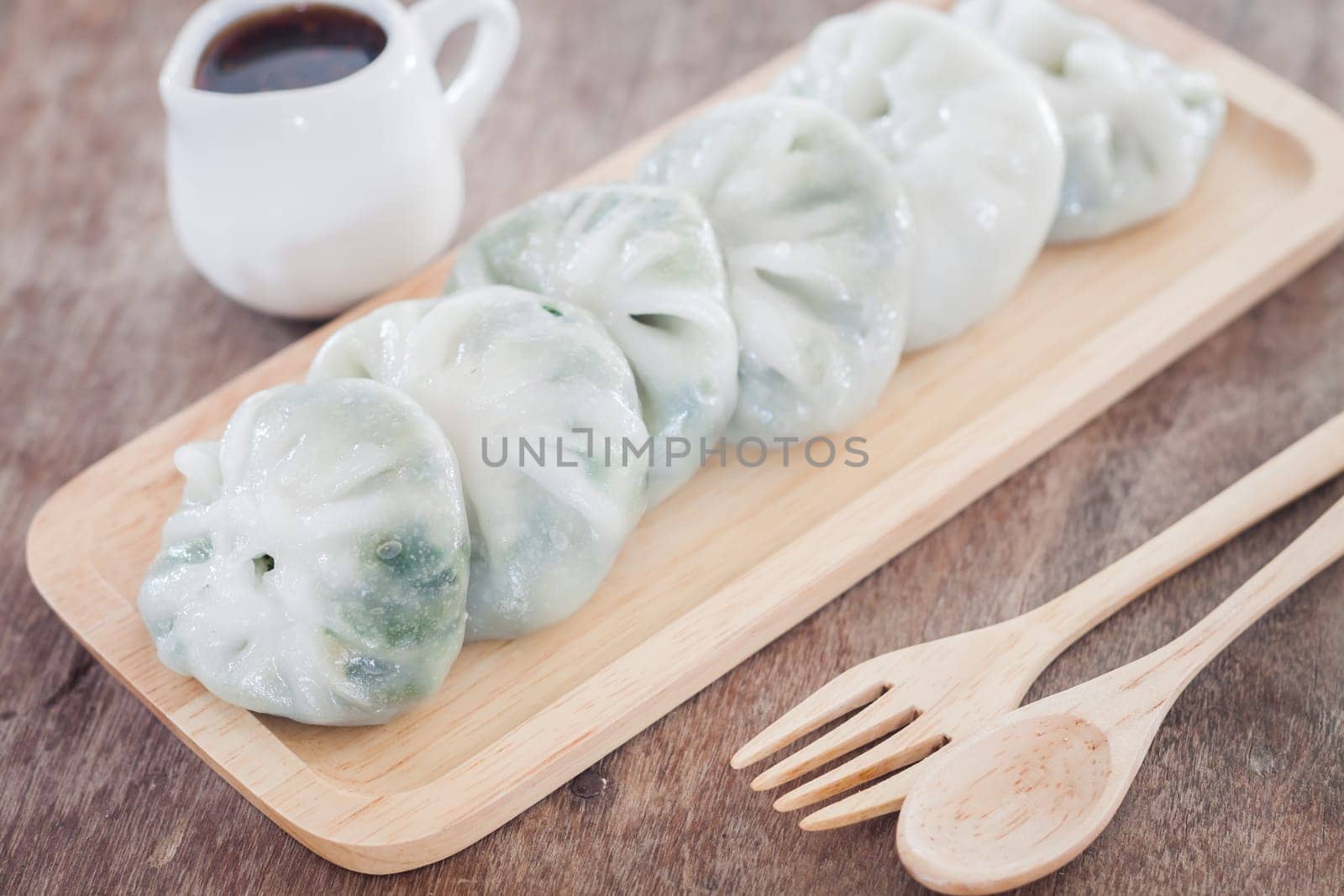 Chinese leek steamed dessert on wooden table, stock photo
