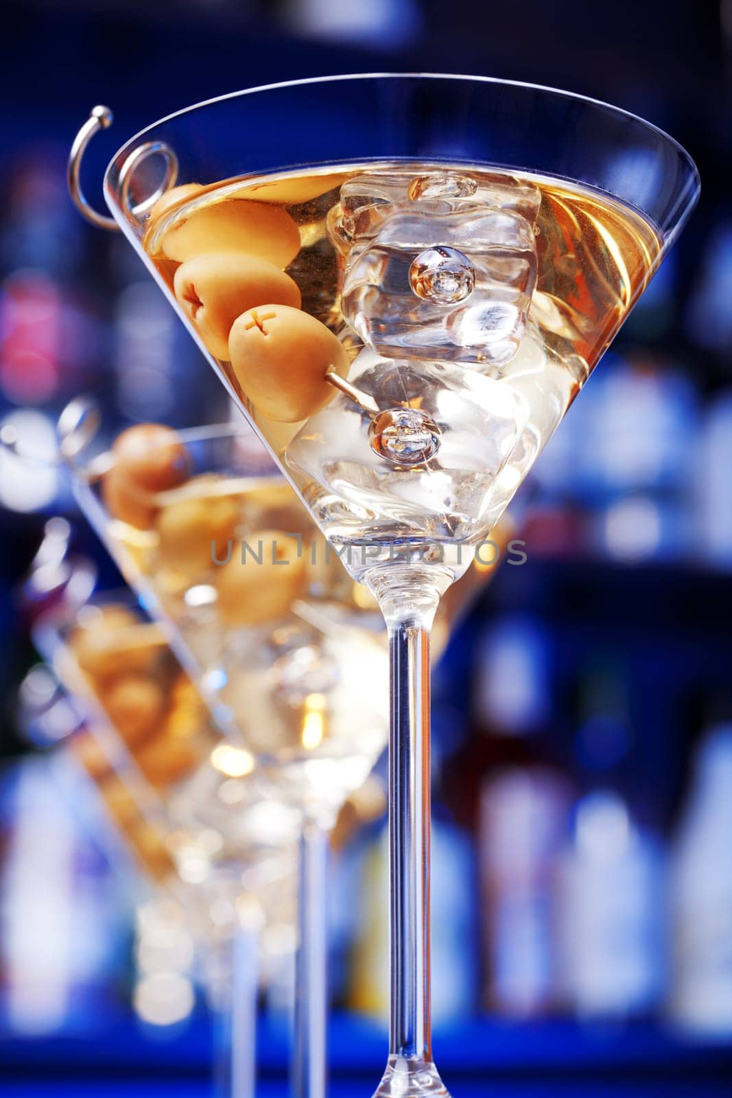 Several glasses of famous cocktail Martini, shot at a bar with shallow depth of field....Ingredients
