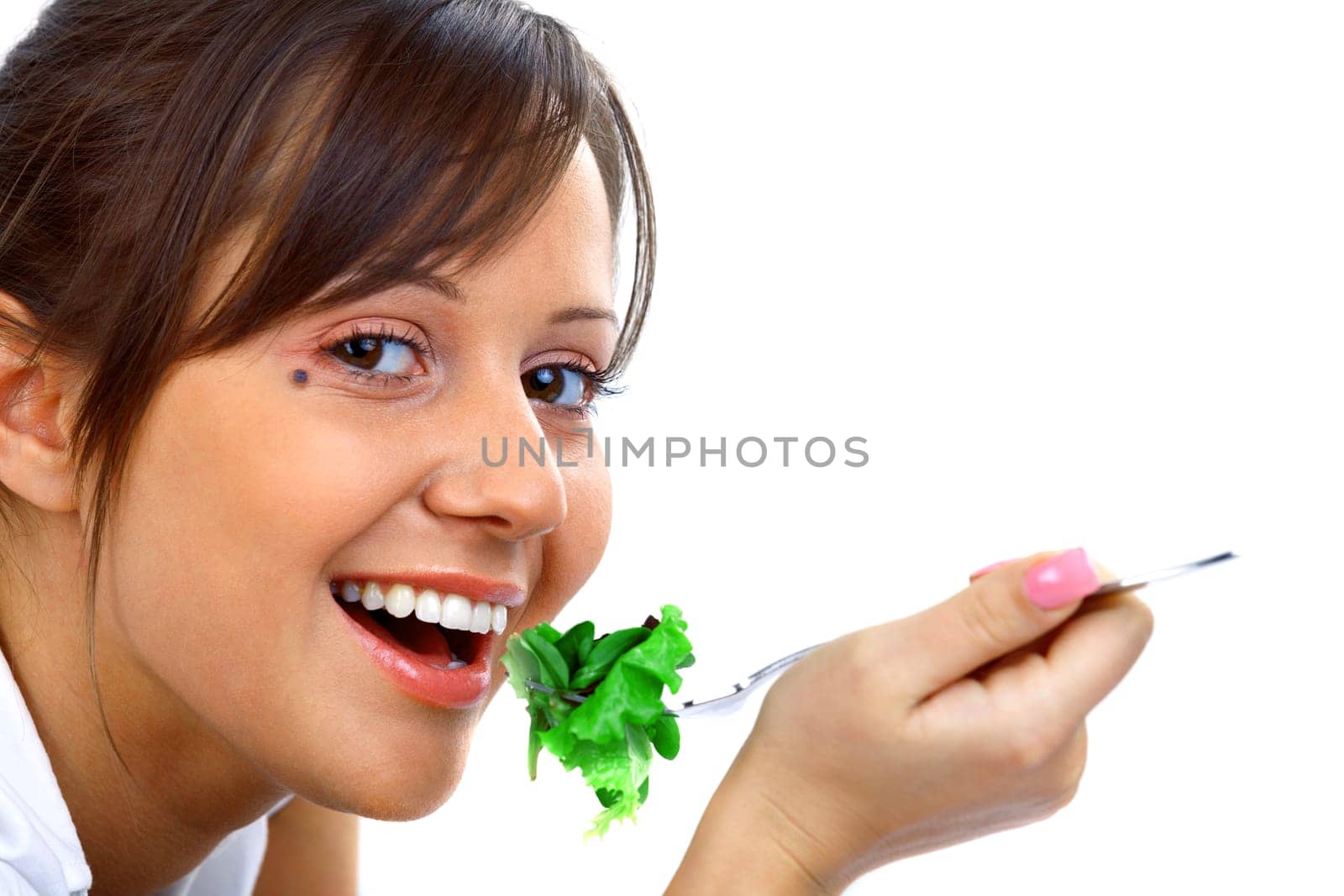Young woman eating healthy salad isolated on white background