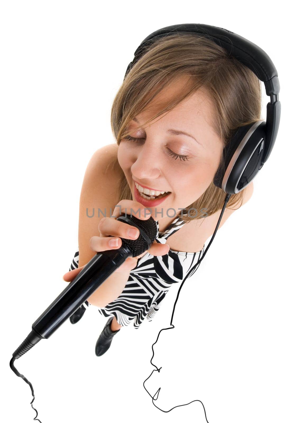 Wide angle shot of girl singing with microphone
